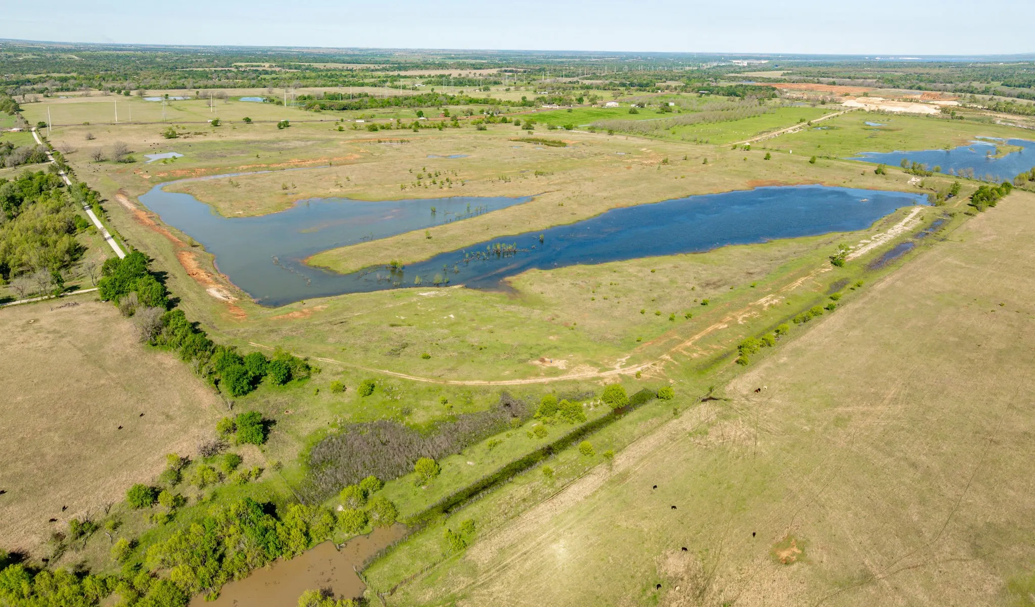 Drone / aerial view featuring a water view and a rural view