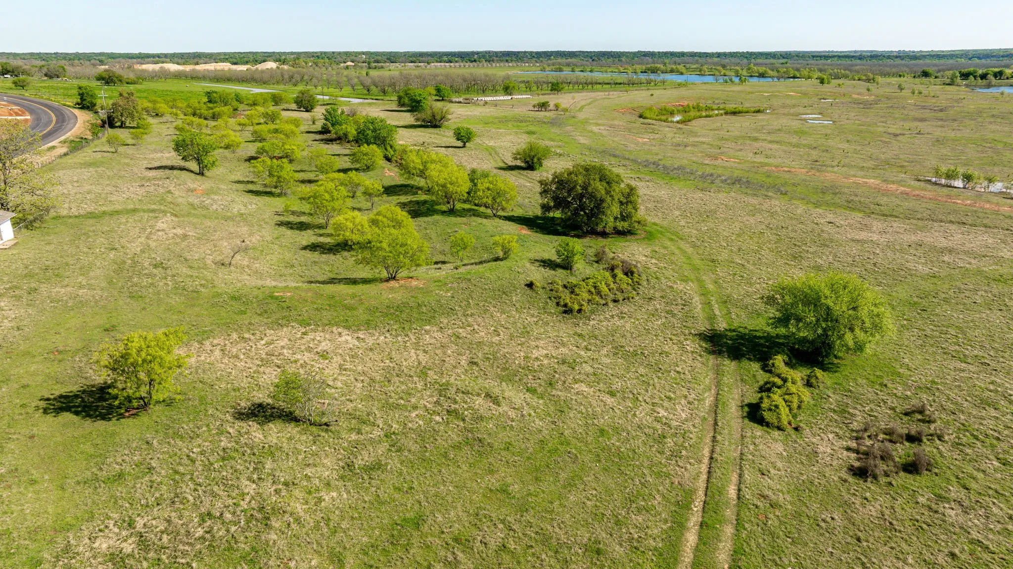 Birds eye view of property featuring a rural view and a water view