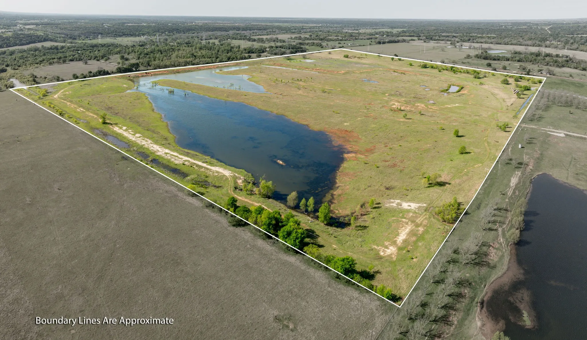 Drone / aerial view with a water view and a rural view