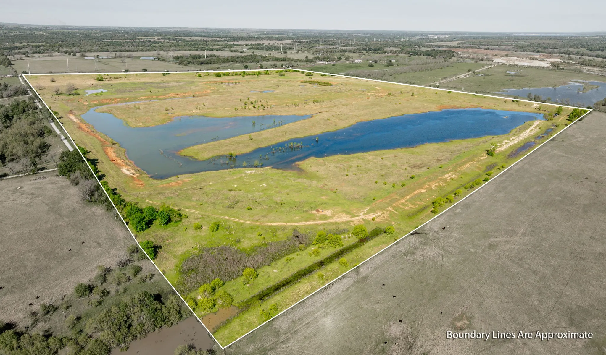 Birds eye view of property featuring a rural view and a water view