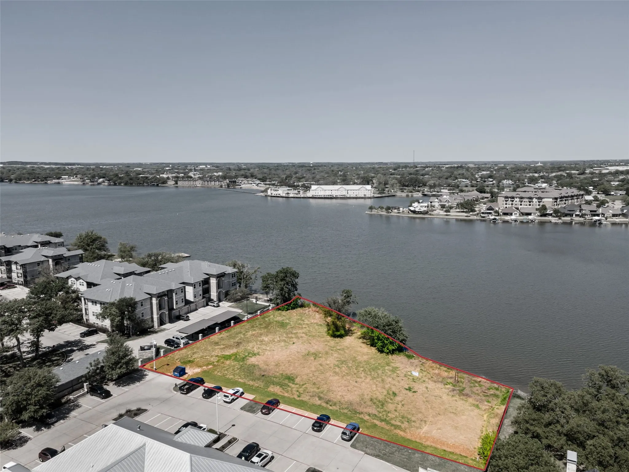 Birds eye view of property with a water view