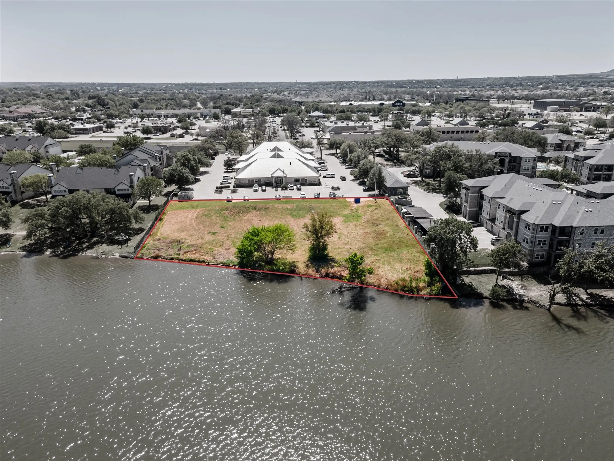 Birds eye view of property featuring a residential view and a water view