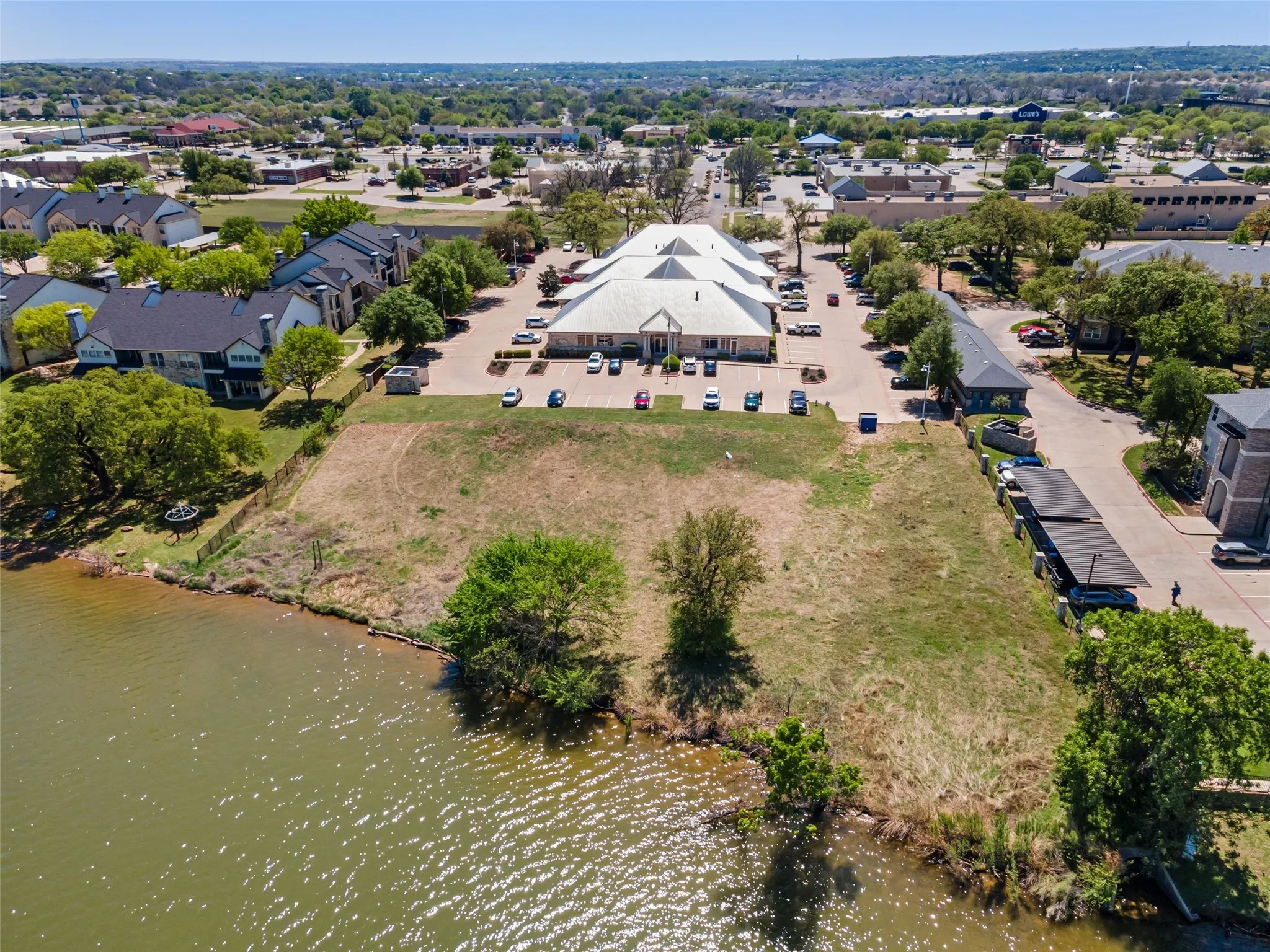 Drone / aerial view featuring a residential view and a water view