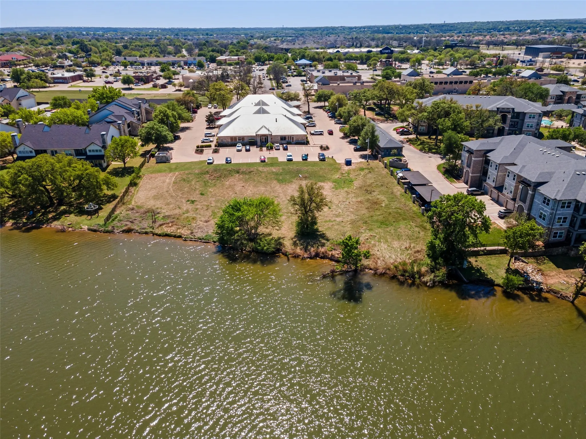 Bird's eye view featuring a water view and a residential view
