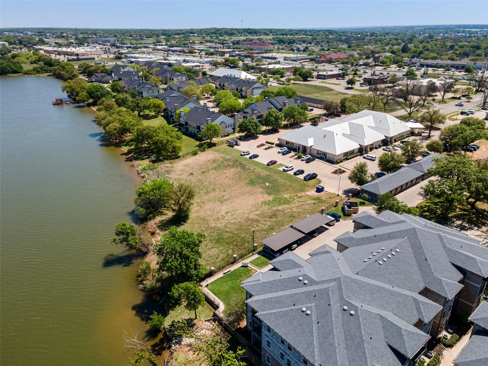 Bird's eye view with a water view and a residential view