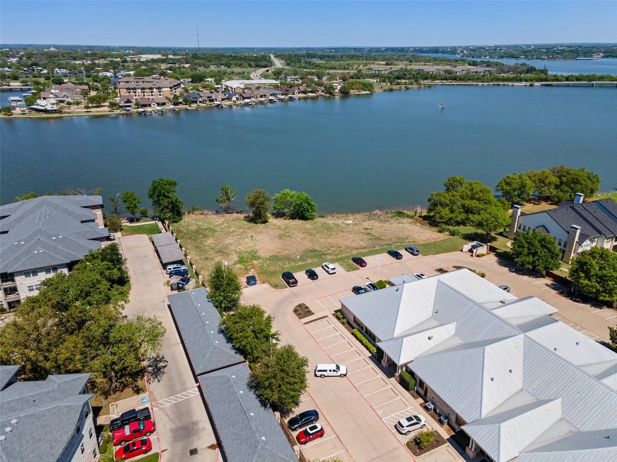 Birds eye view of property with a residential view and a water view