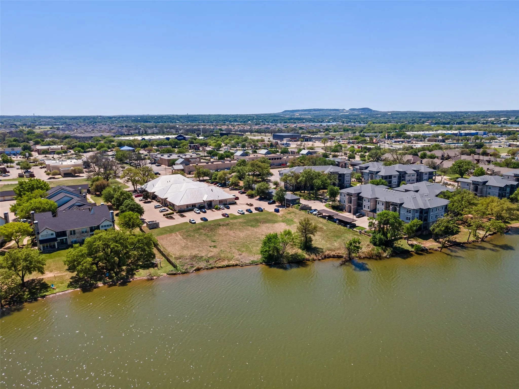 Aerial view featuring a water view and a residential view