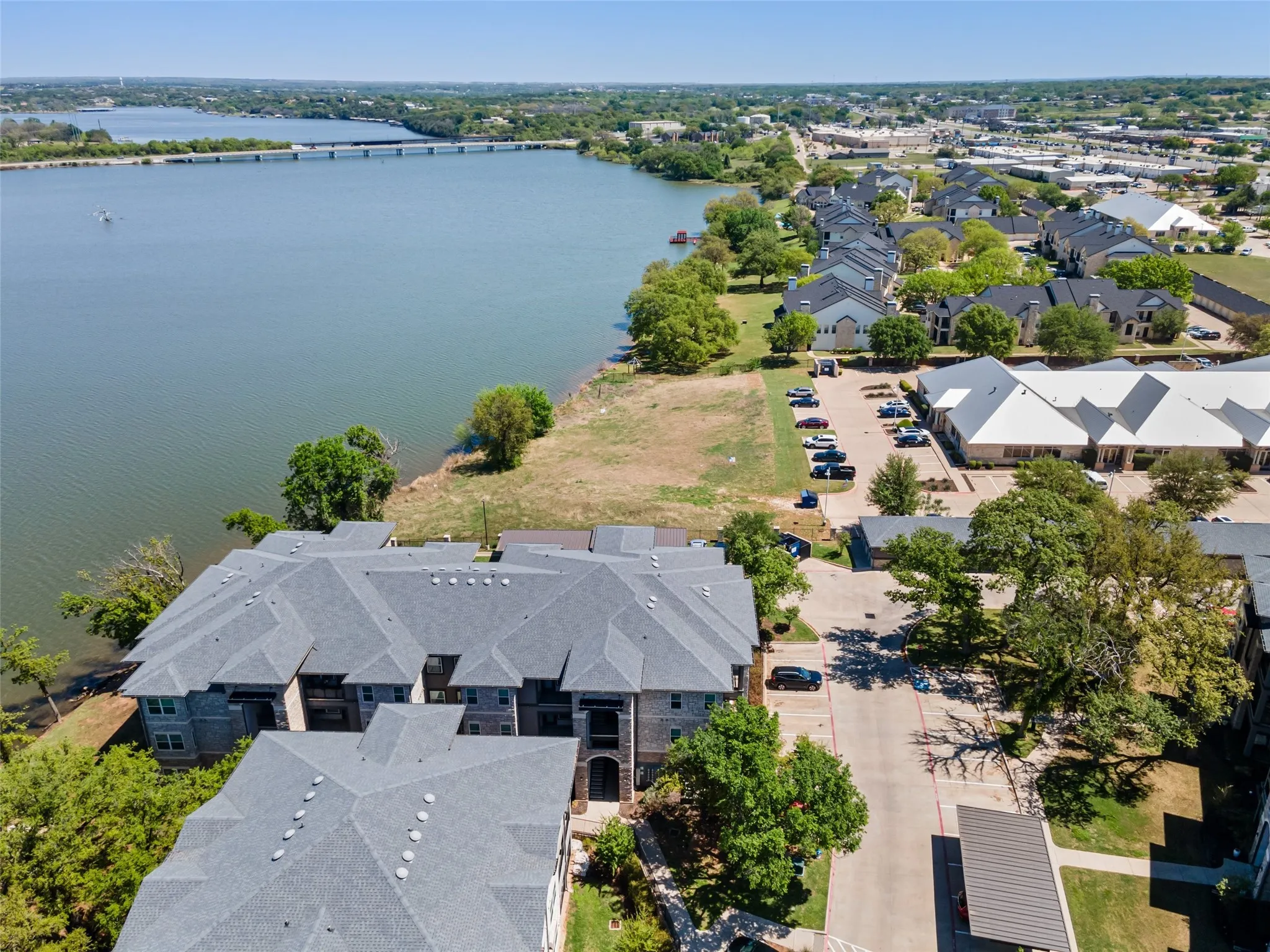 Aerial view featuring a residential view and a water view
