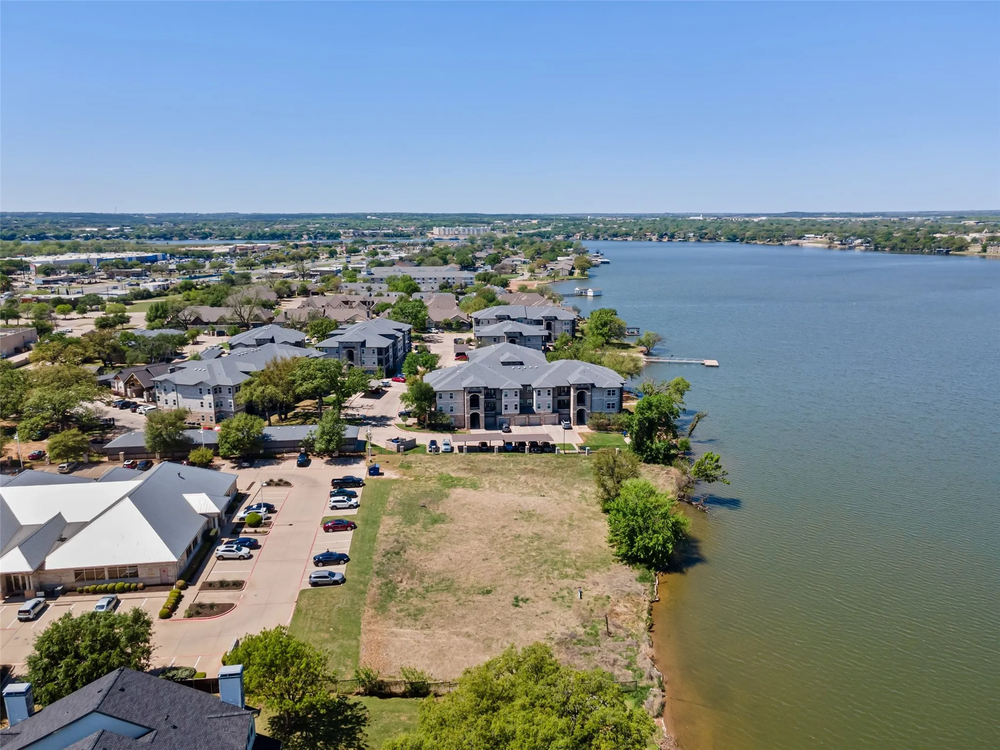 Aerial view with a water view and a residential view
