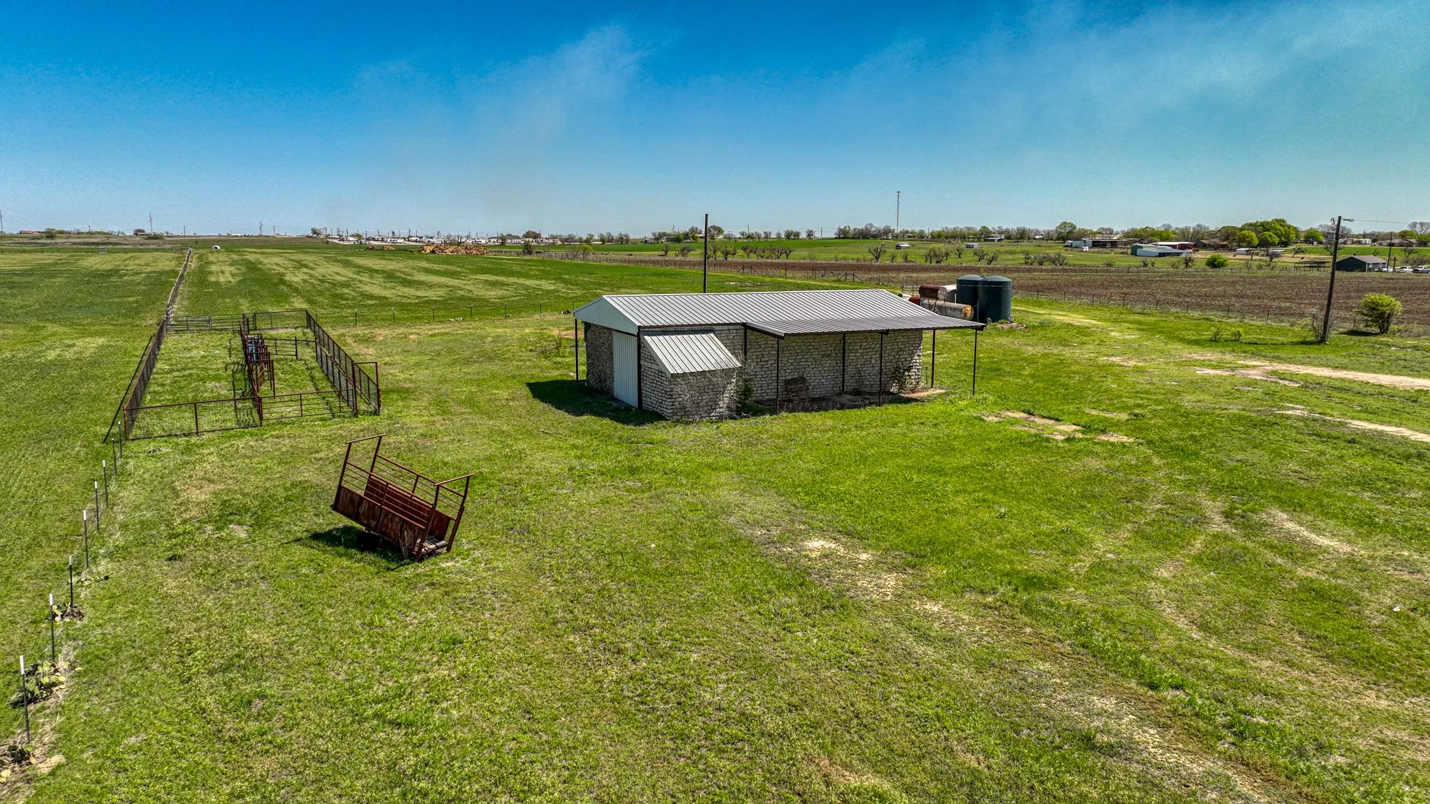 Birds eye view of property with a rural view