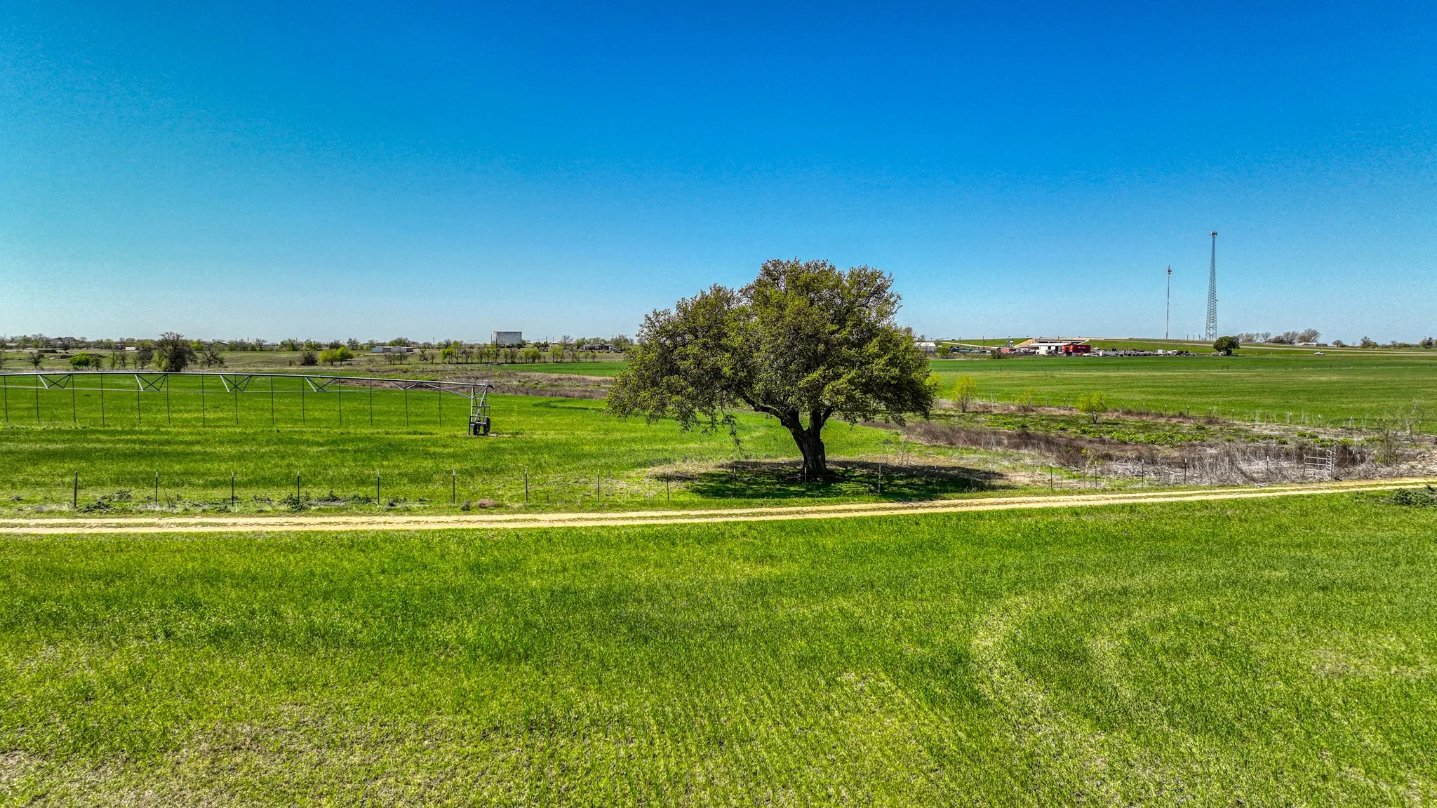 View of yard with a rural view and fence