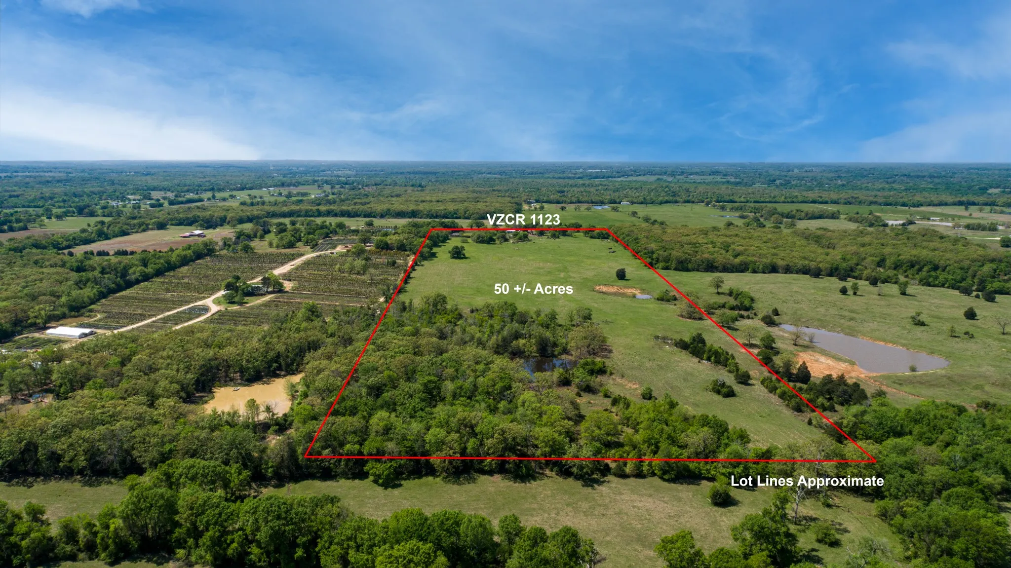 Birds eye view of property with a rural view