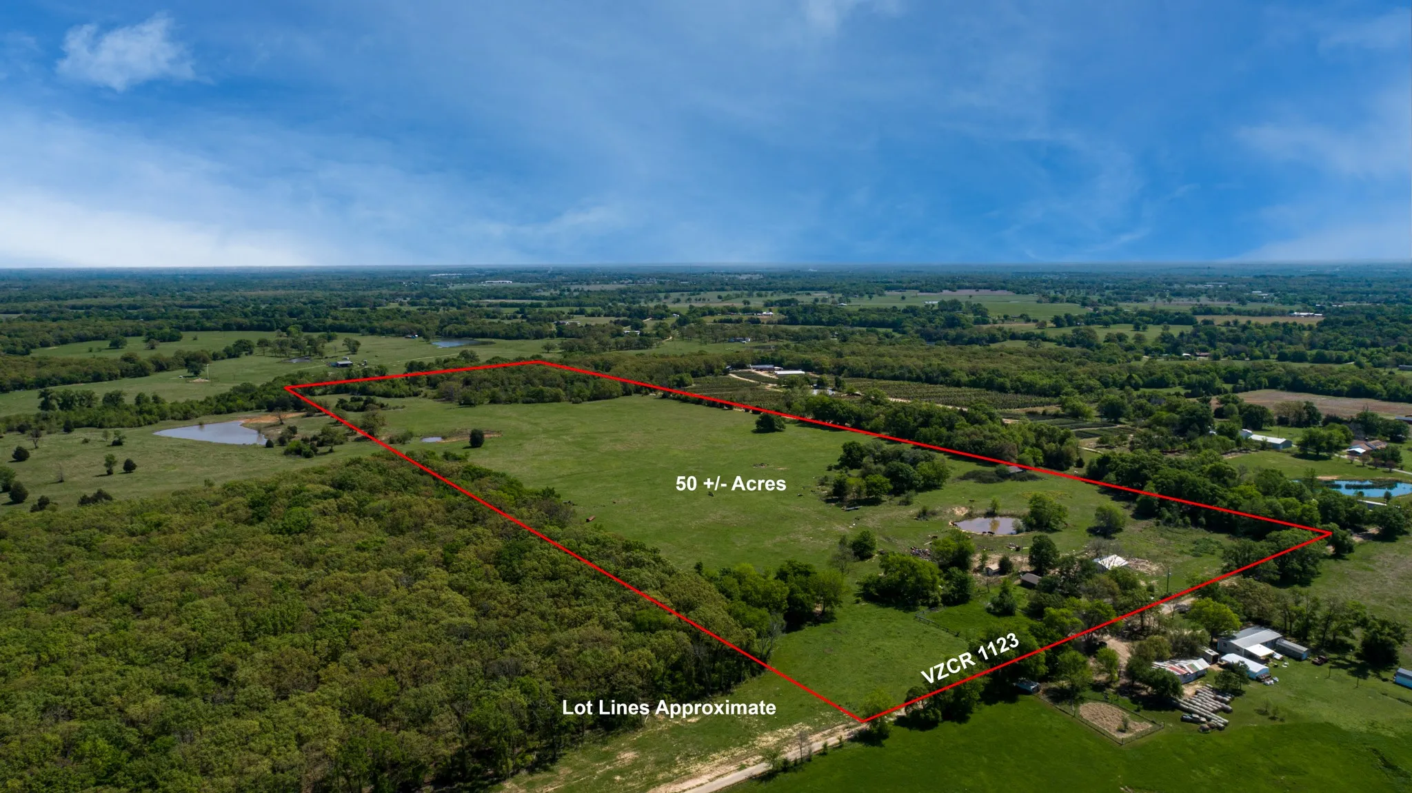 Birds eye view of property featuring a rural view