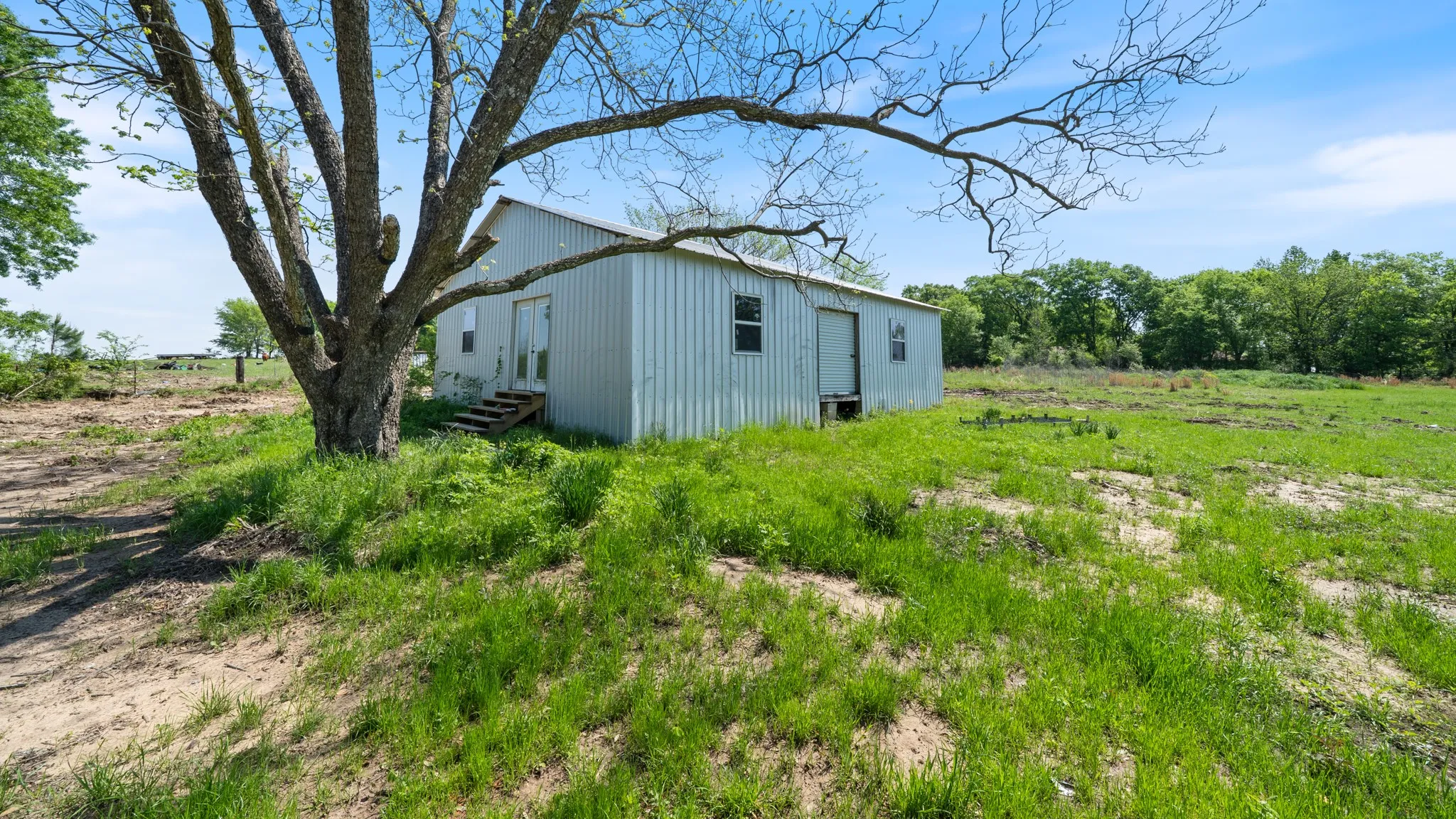 View of yard with entry steps