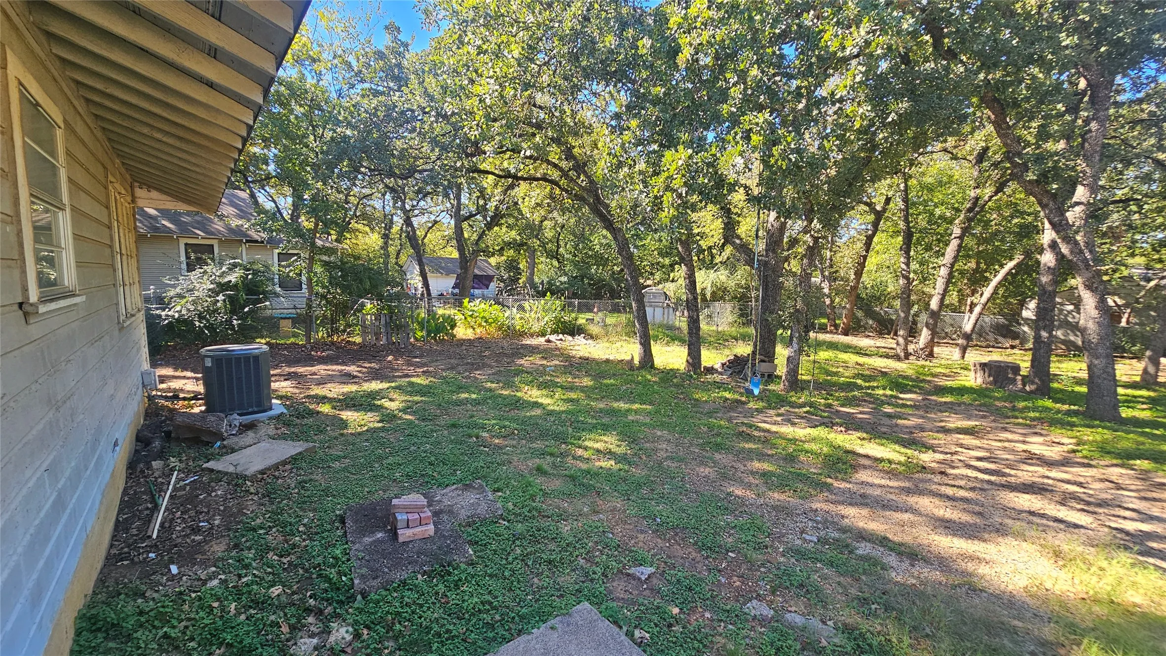 View of yard featuring view of wooded area