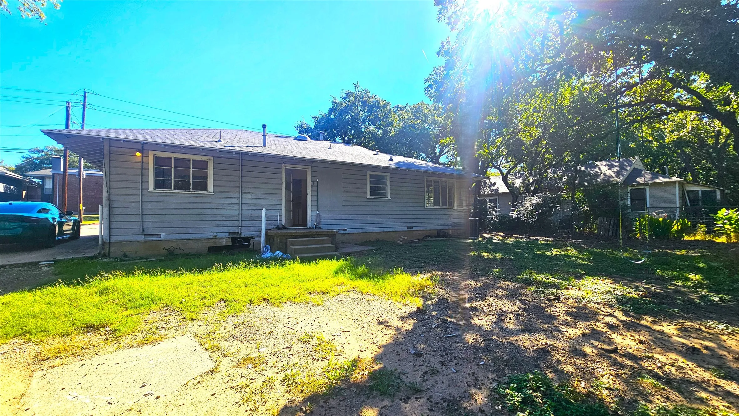 Back of house with crawl space