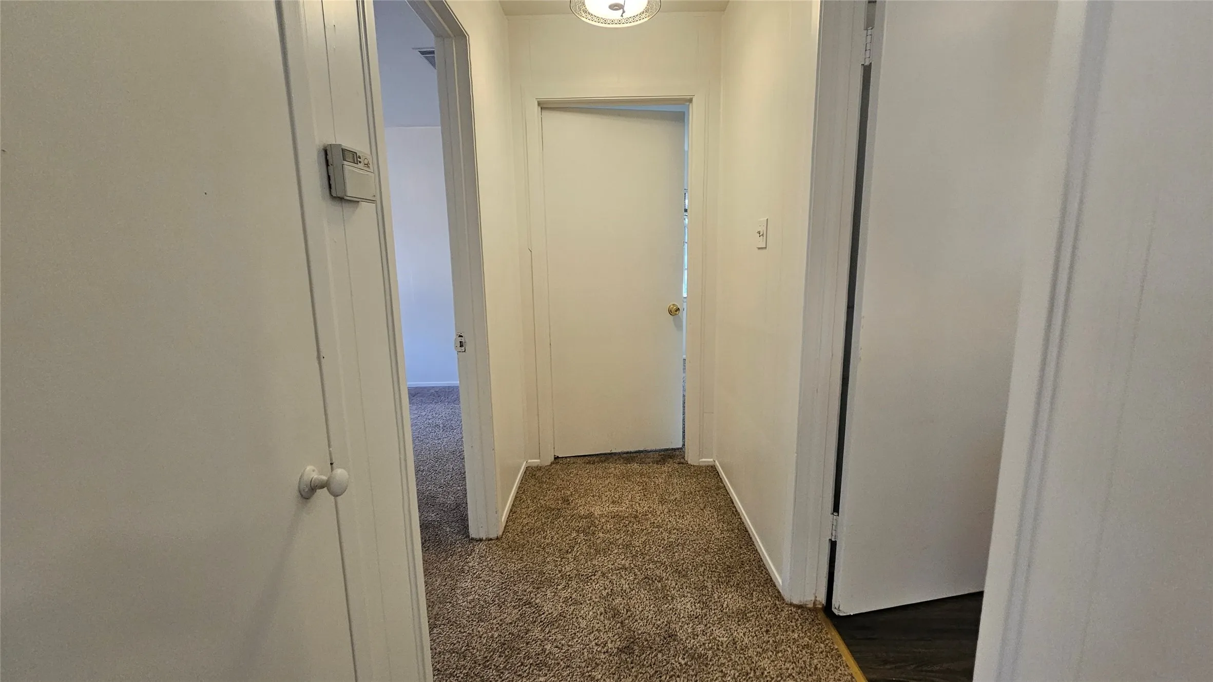 Hall with dark carpet