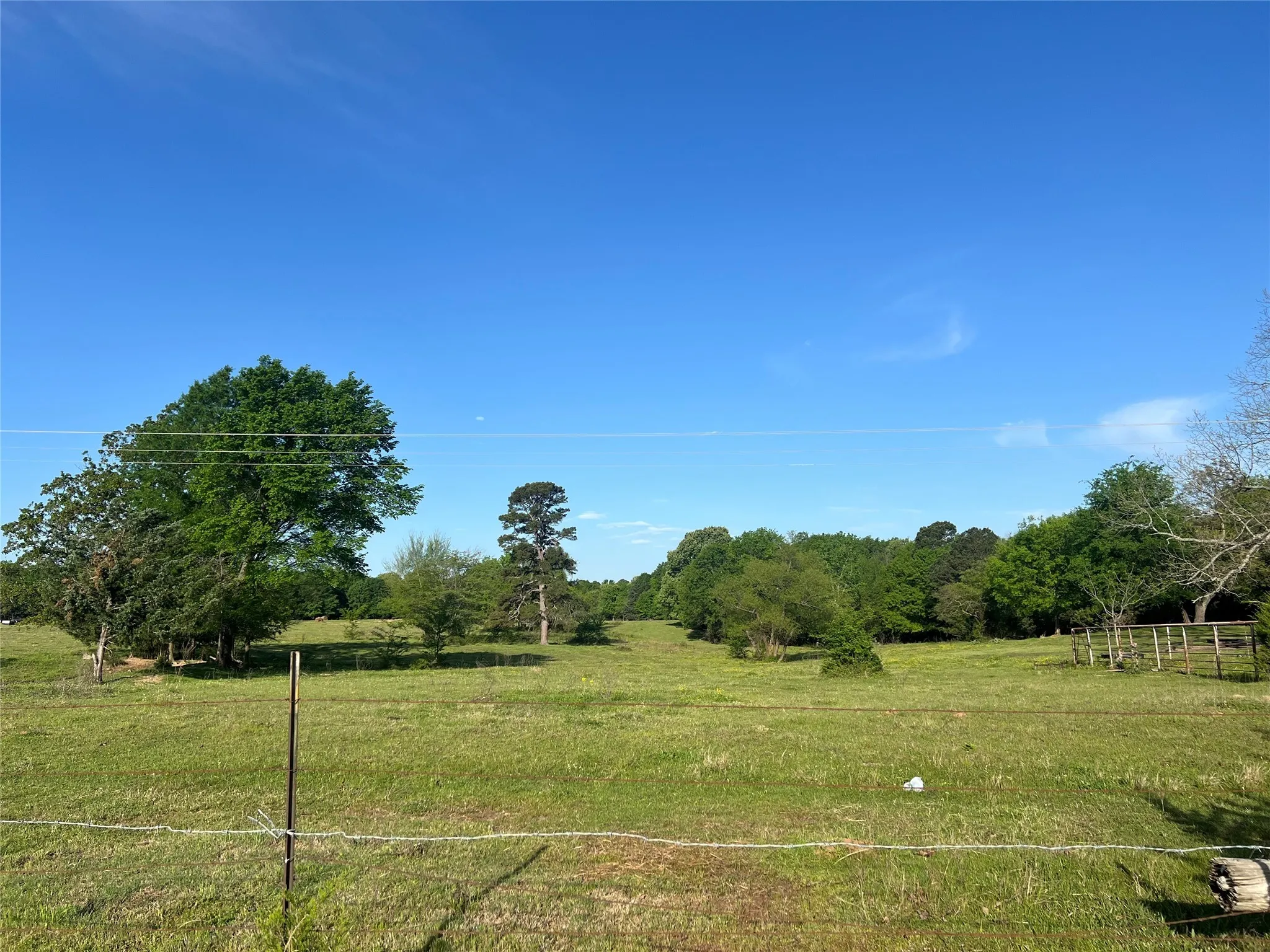 View of yard featuring a rural view and fence