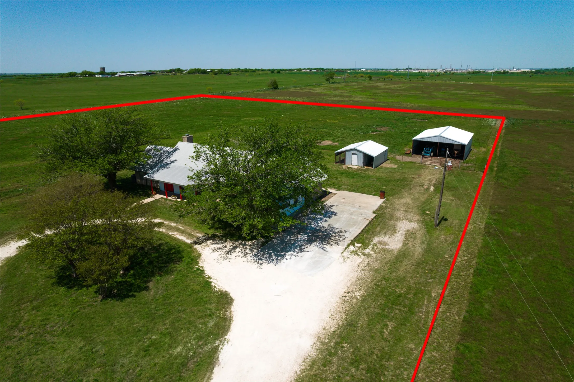 Birds eye view of property with a rural view