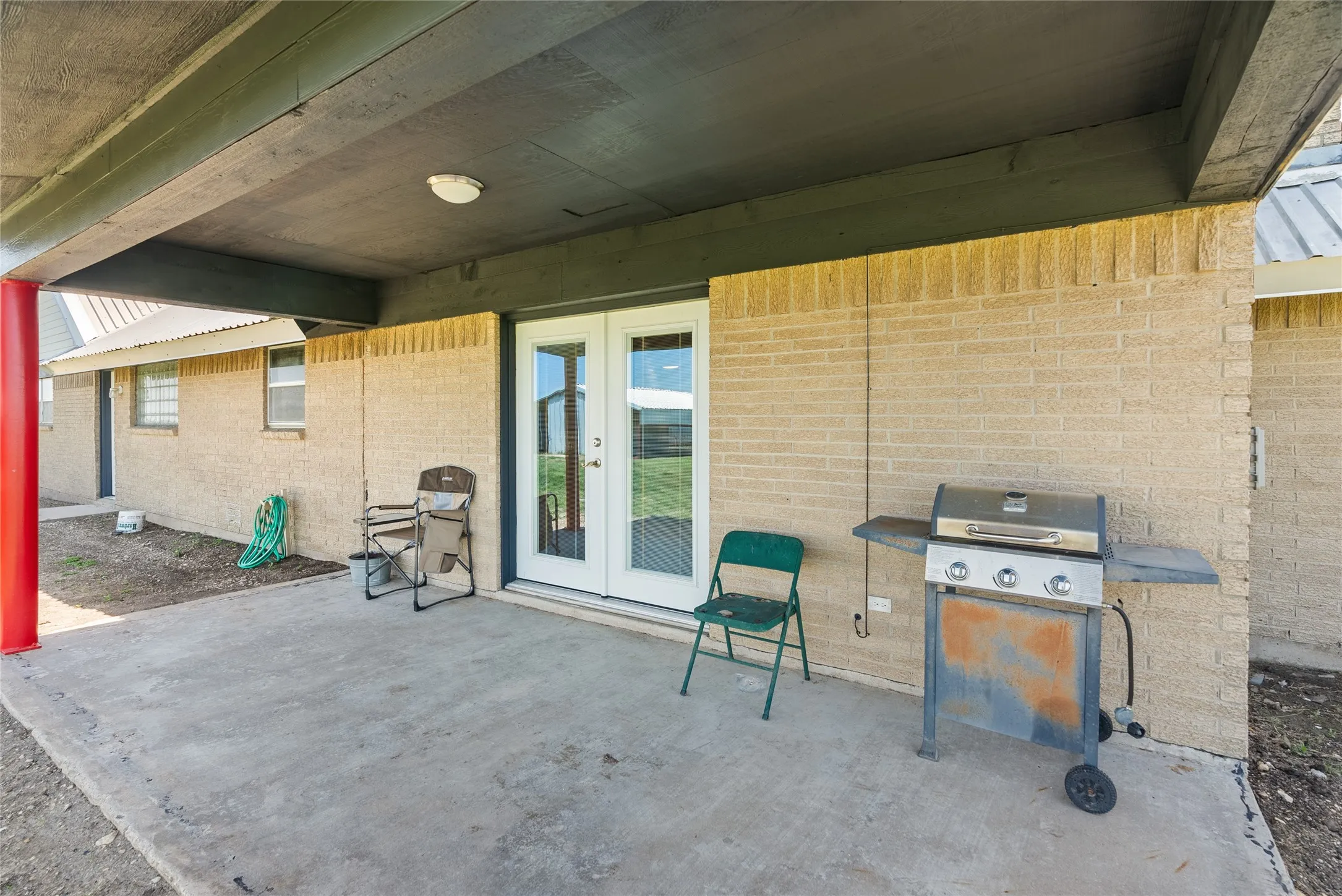View of patio featuring area for grilling and french doors
