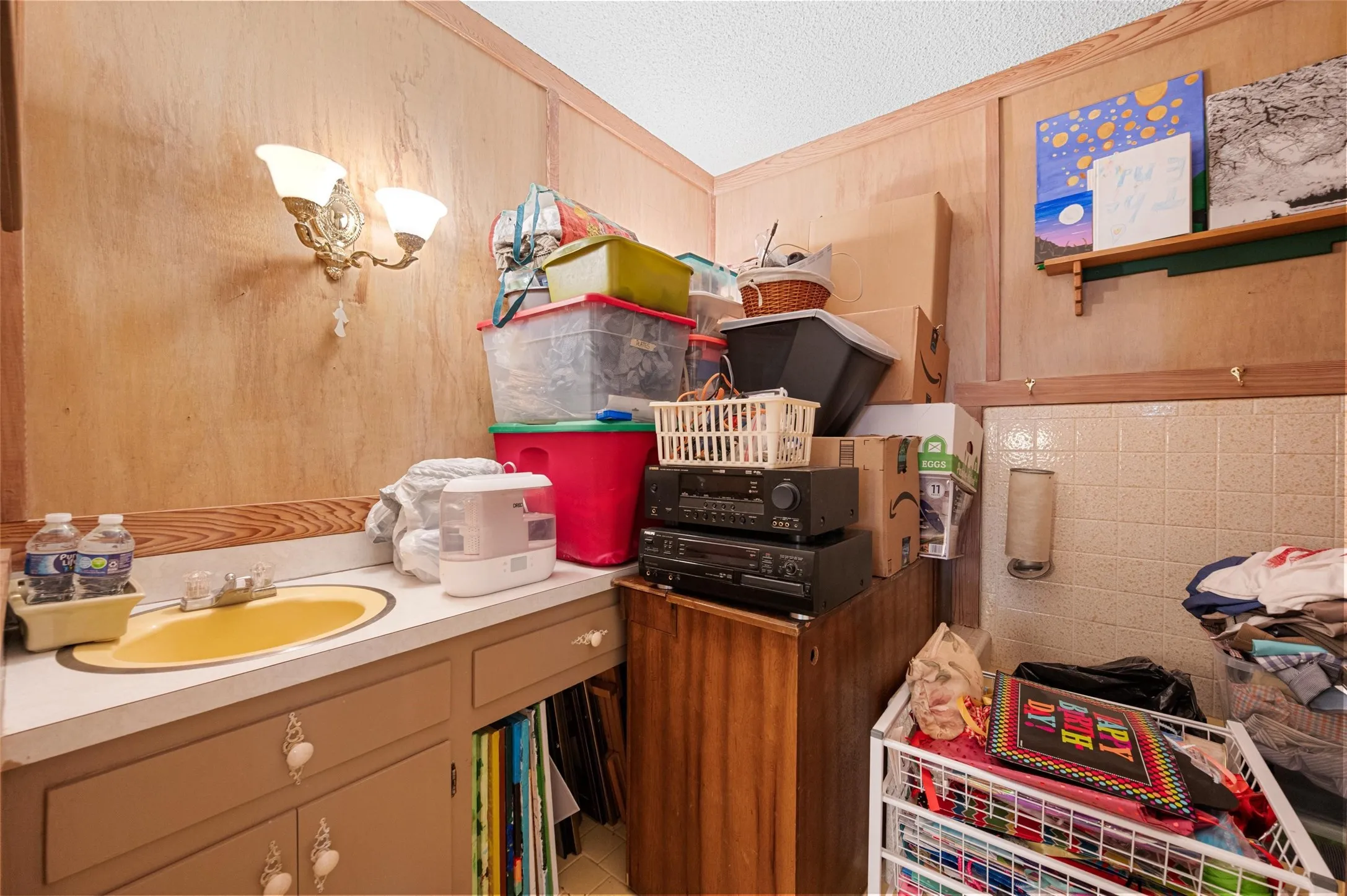 Bathroom featuring vanity and a textured ceiling