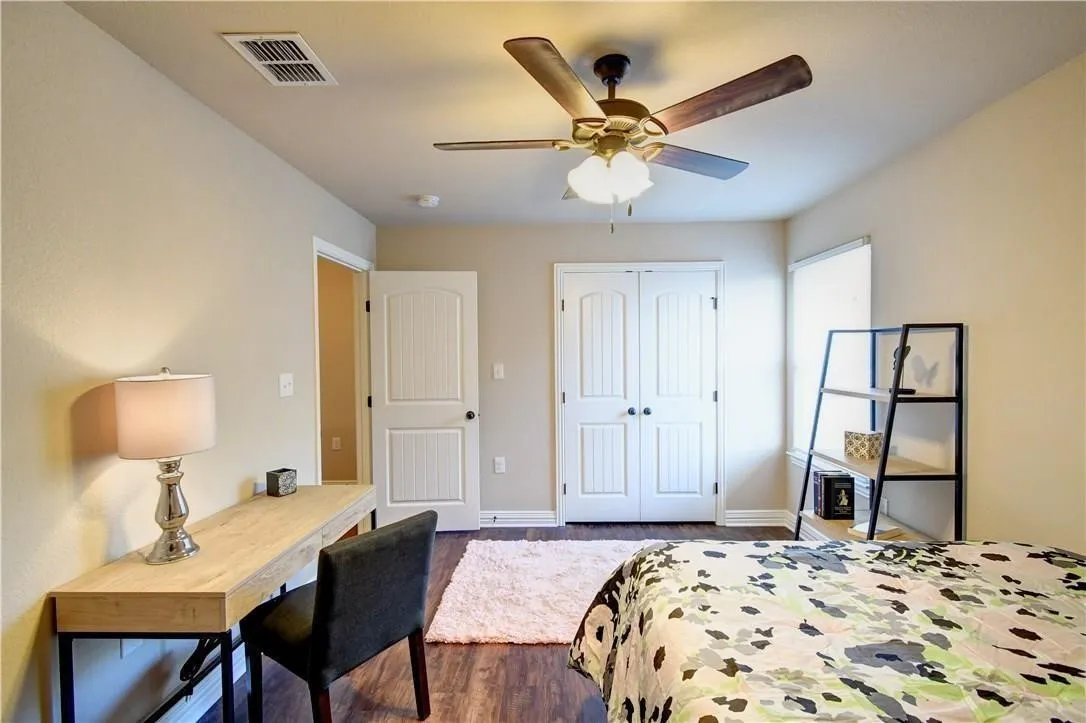 Bedroom will hold large bed, desk, chair and book shelves, ceiling fan