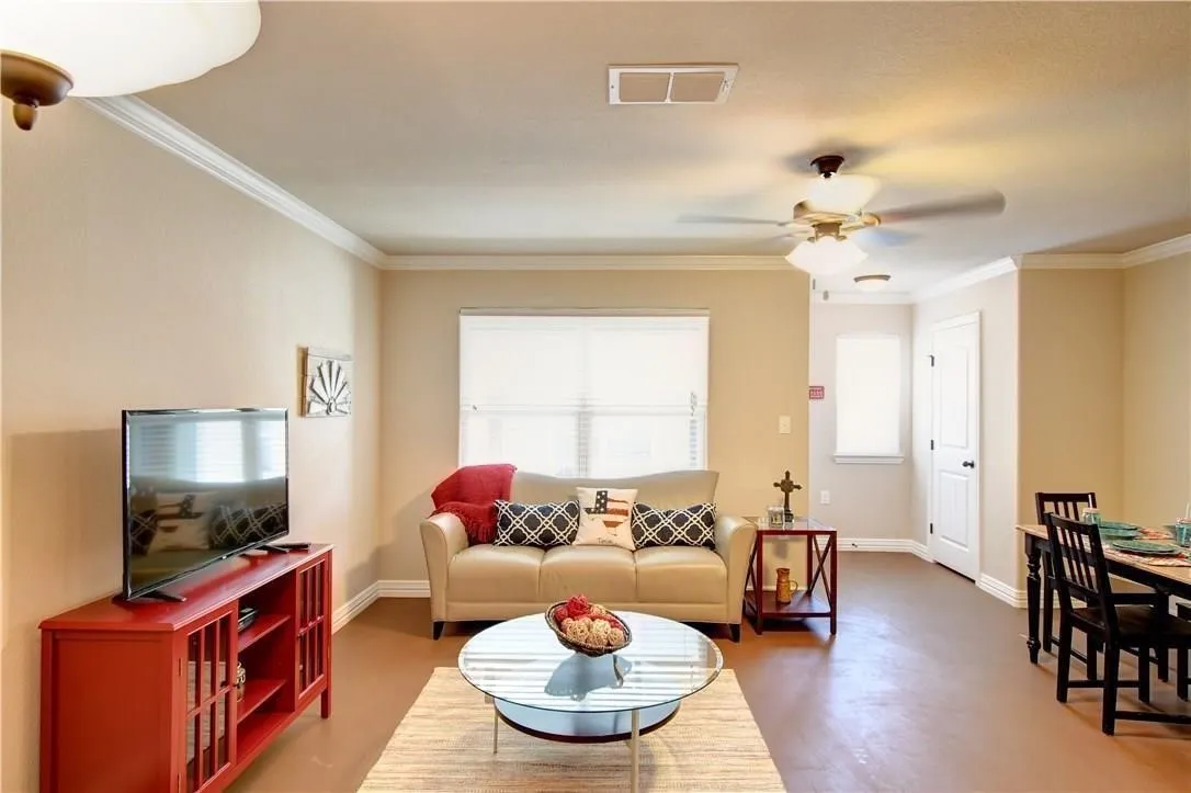 Concrete floors, ceiling fan, pantry, large living area