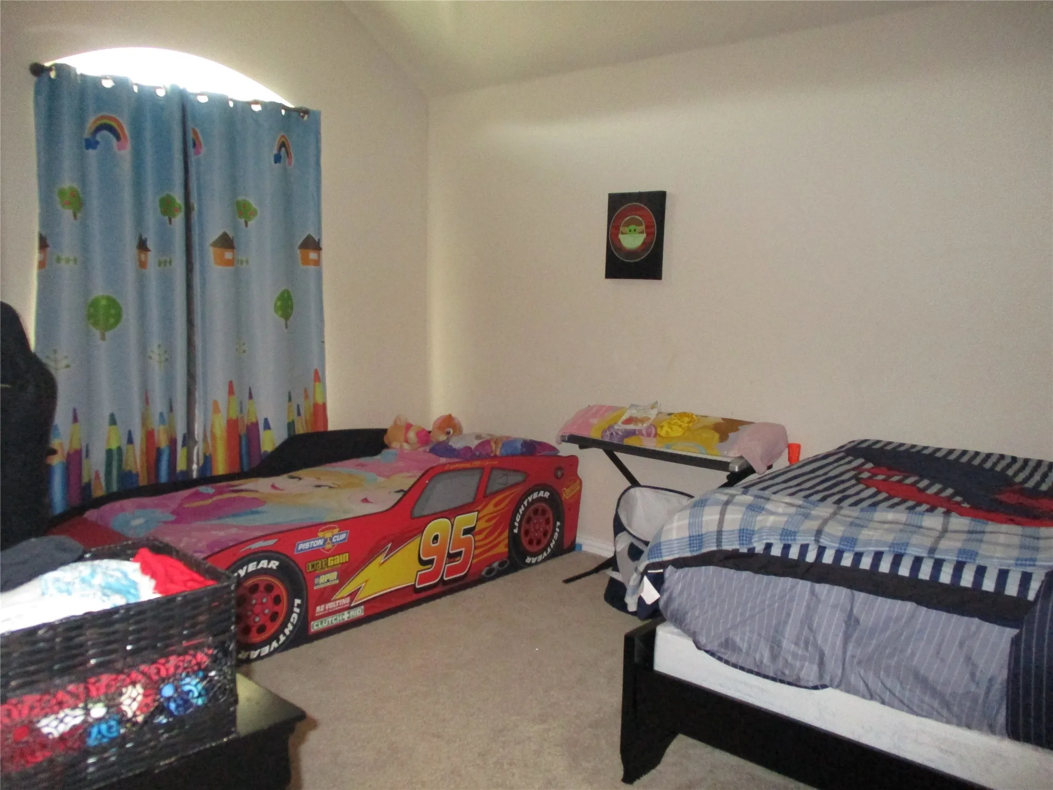 Bedroom featuring carpet and lofted ceiling