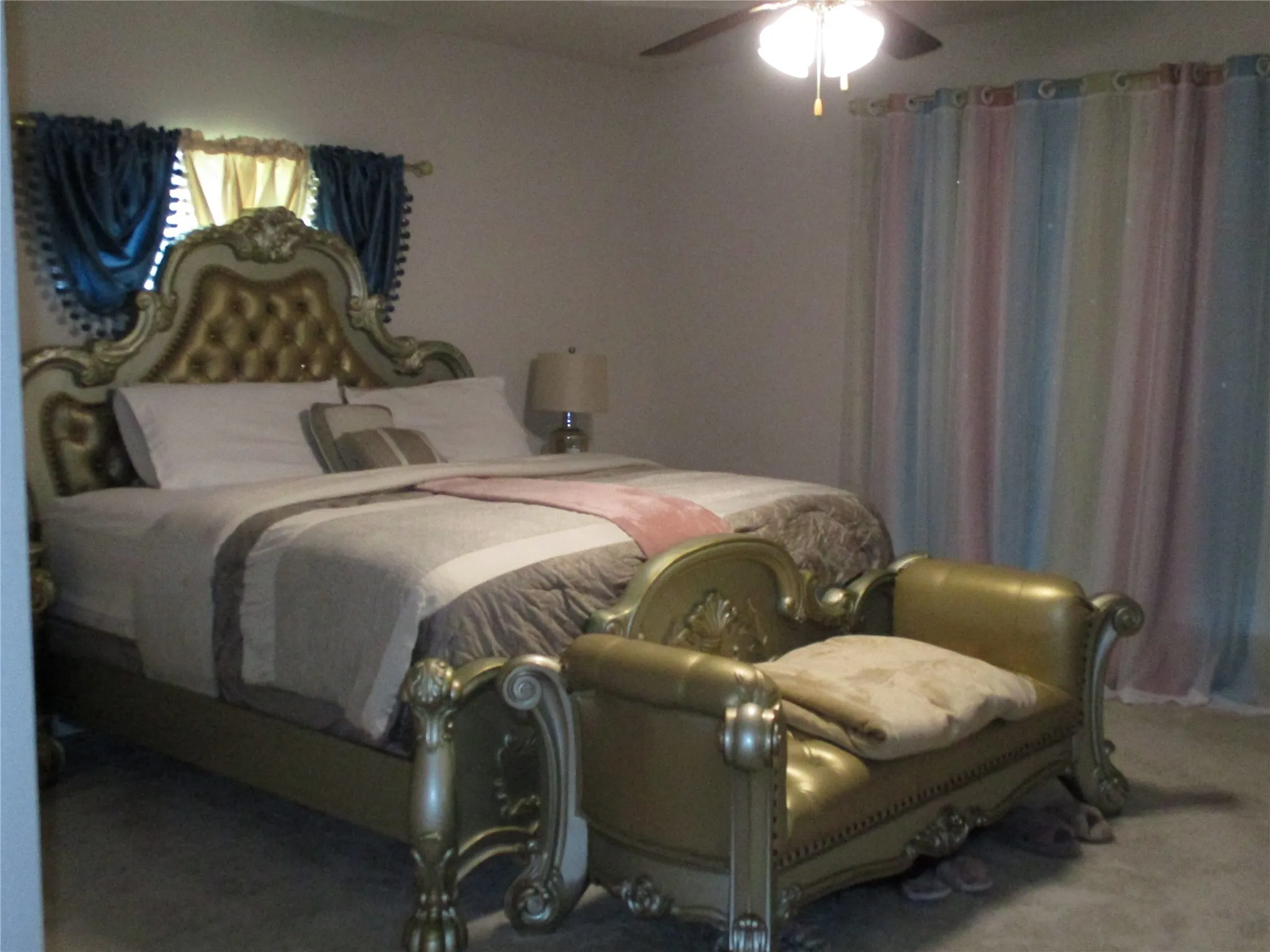 Bedroom with carpet and a ceiling fan