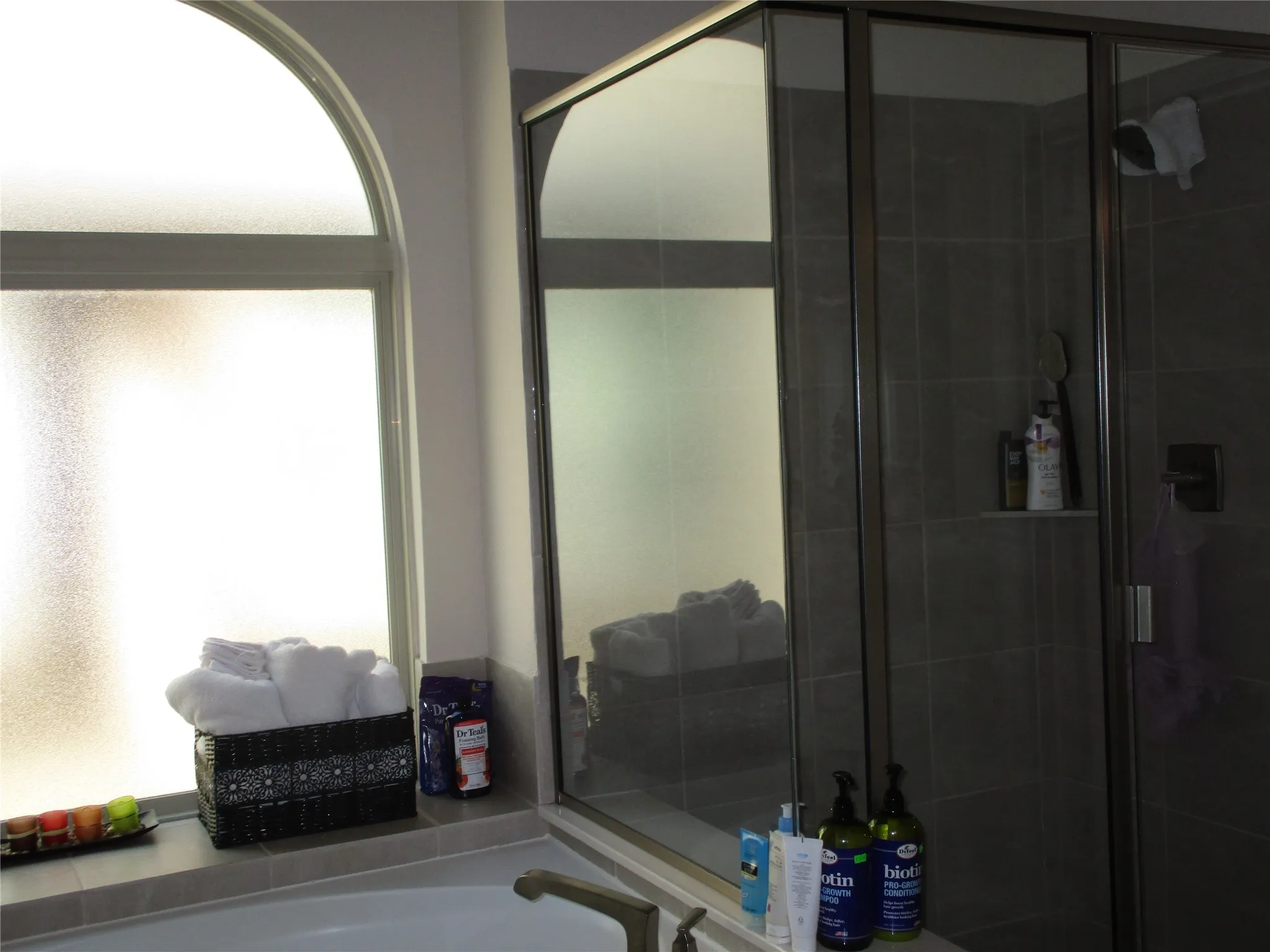 Full bathroom with a shower stall