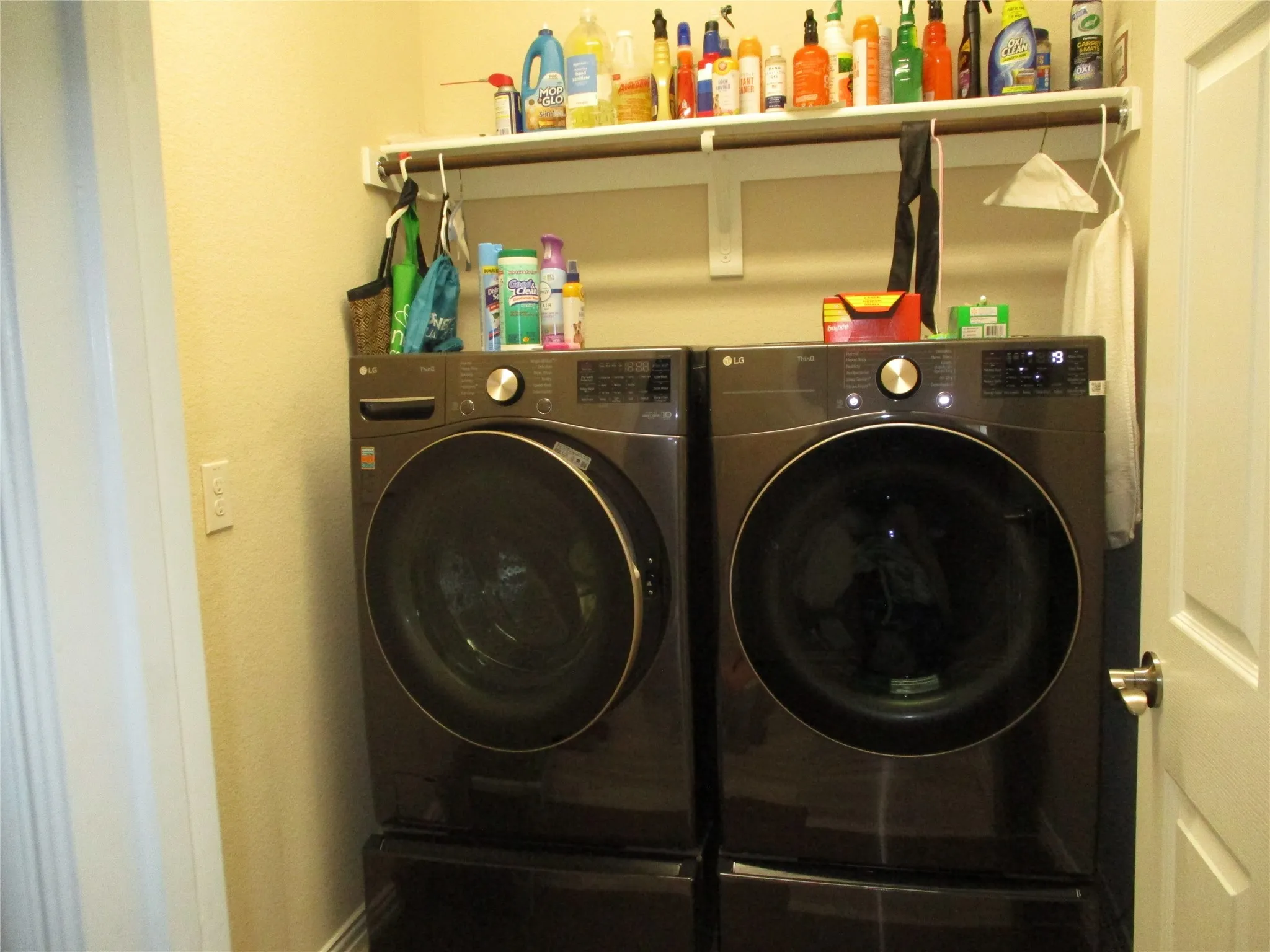 Laundry area with laundry area and washing machine and clothes dryer