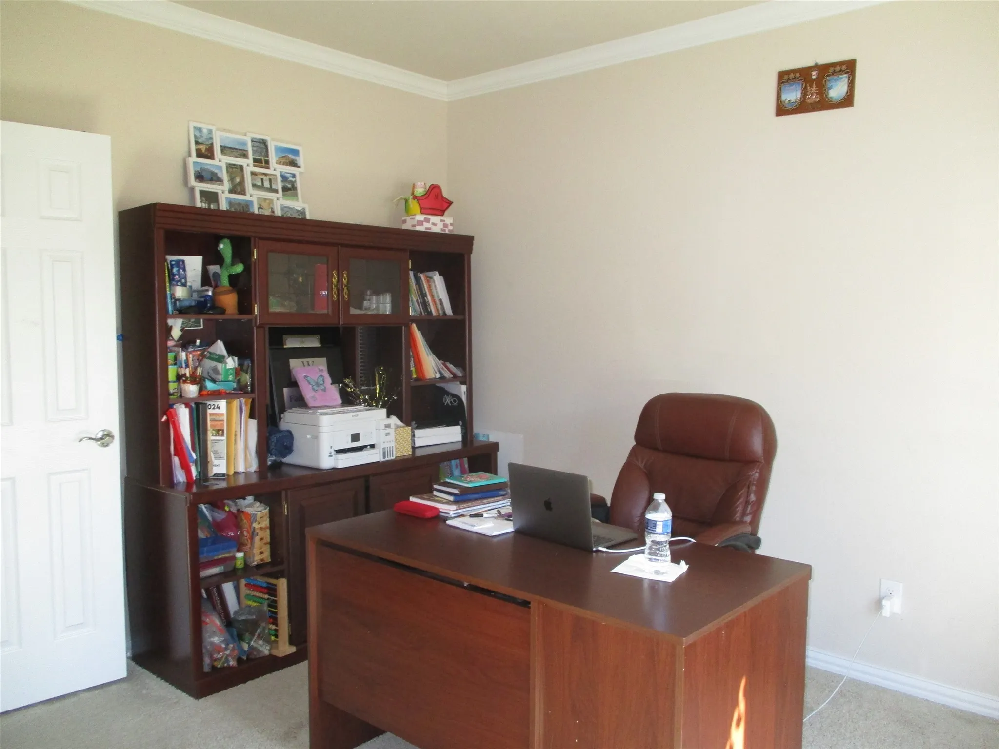 Office with light carpet, baseboards, and ornamental molding