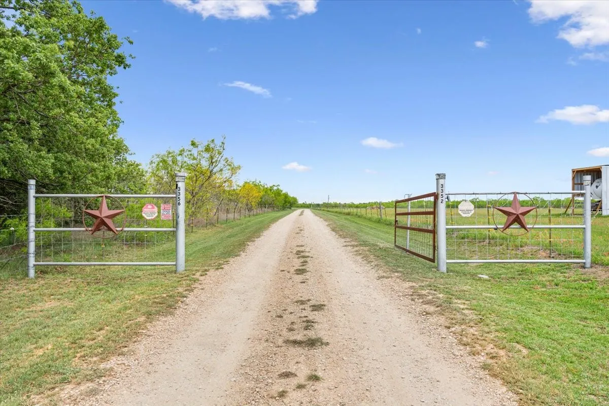 View of road featuring a gated entry