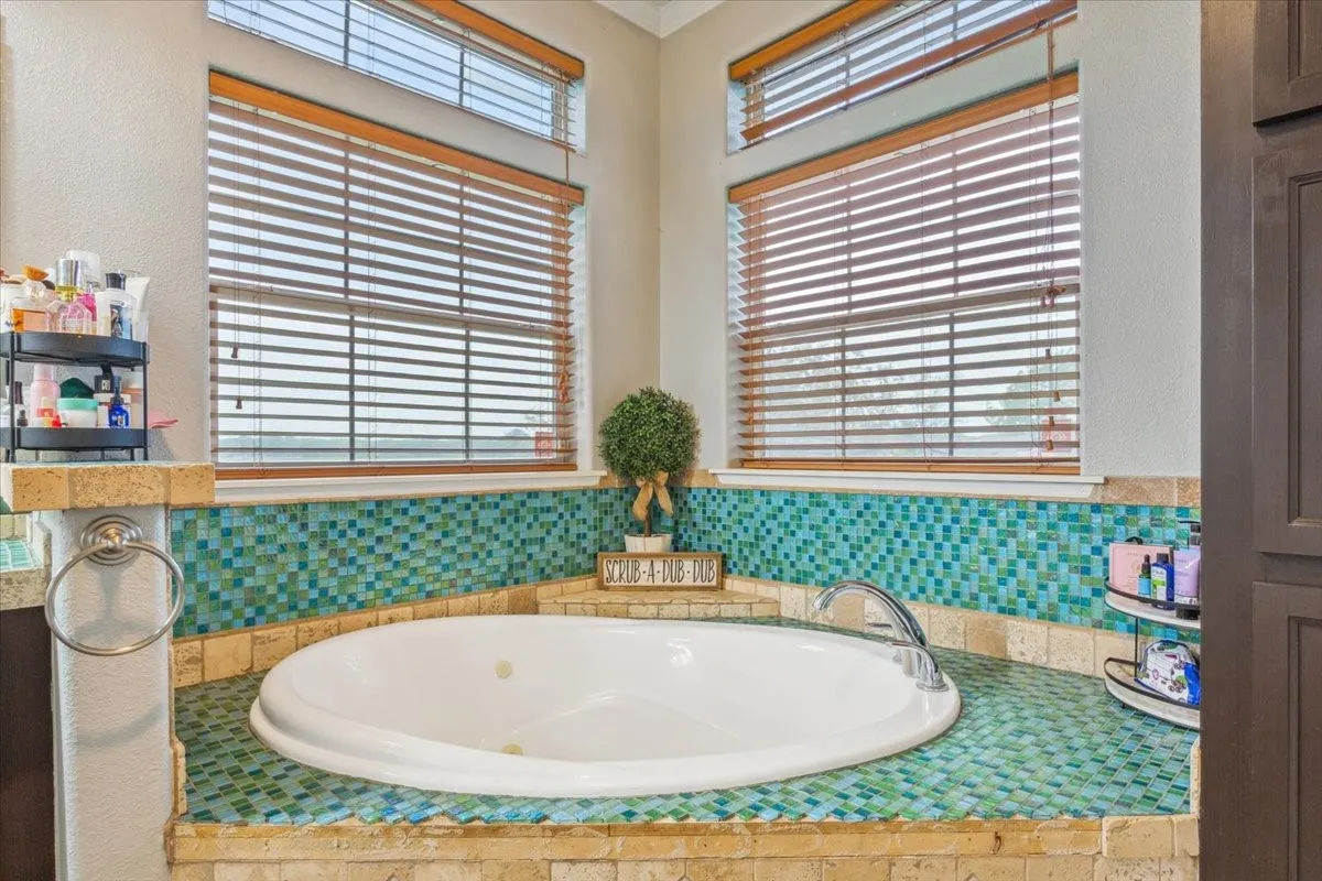 Full bath featuring a bath
