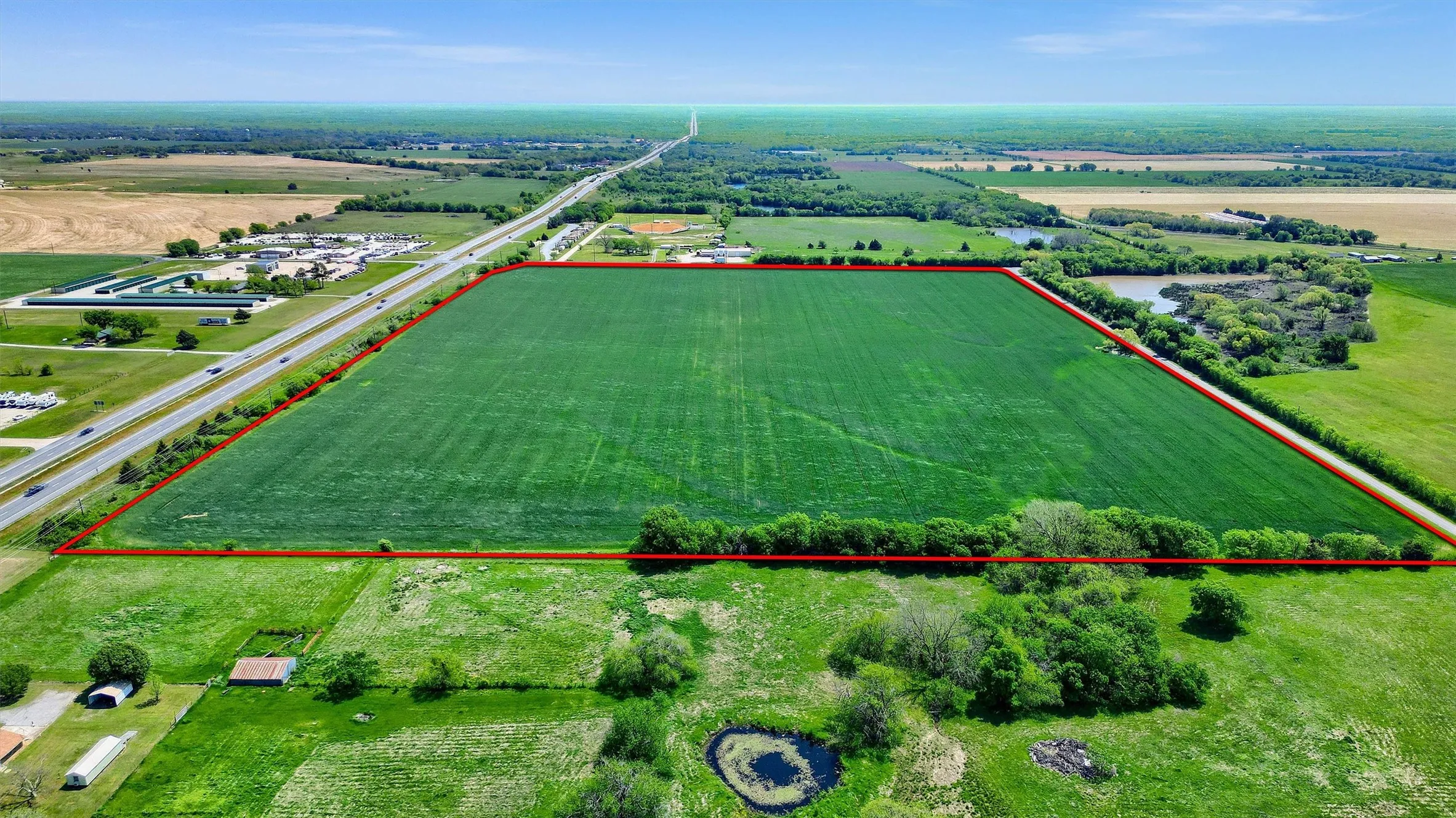 Birds eye view of property with a rural view