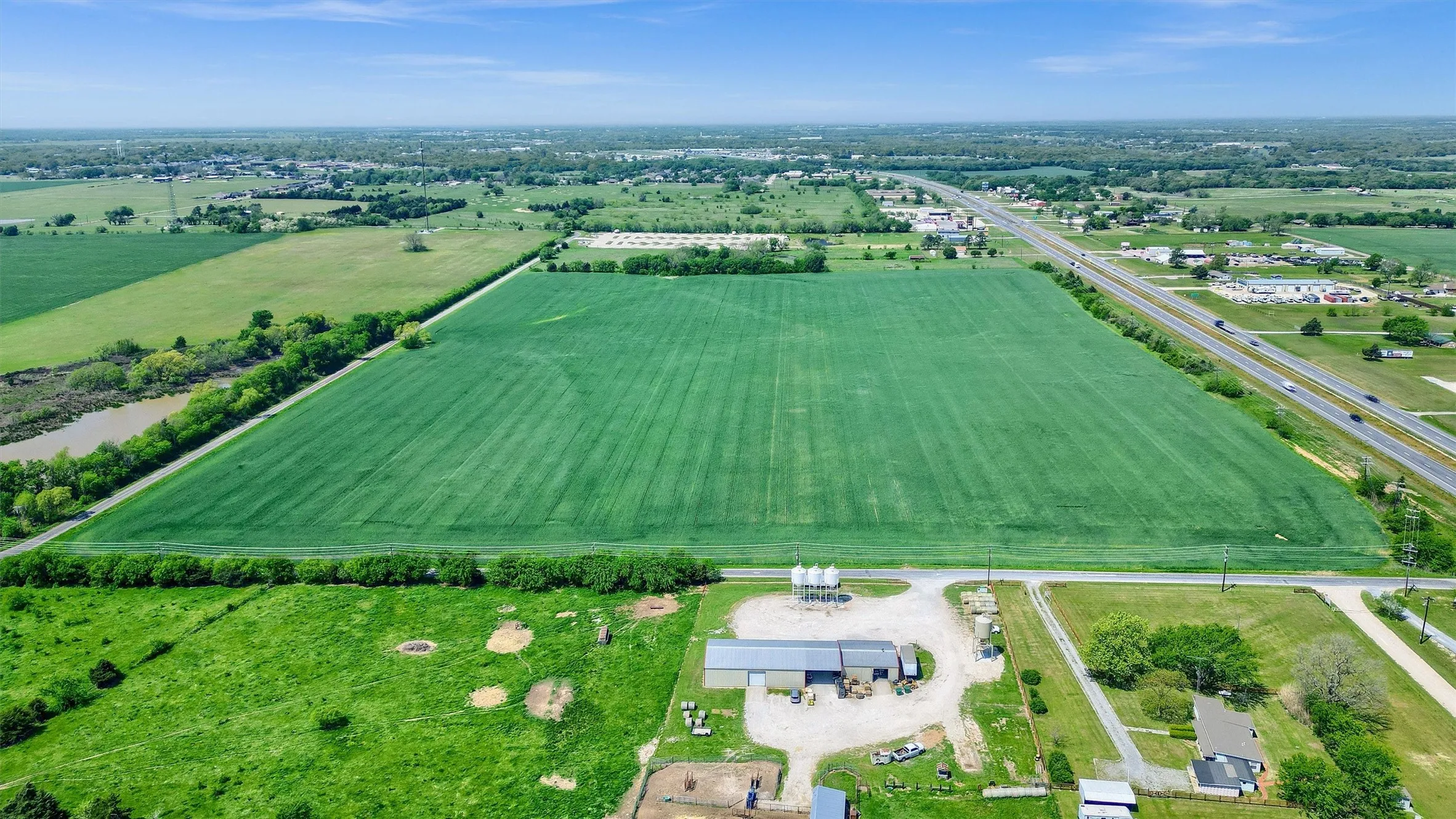 Birds eye view of property with a rural view