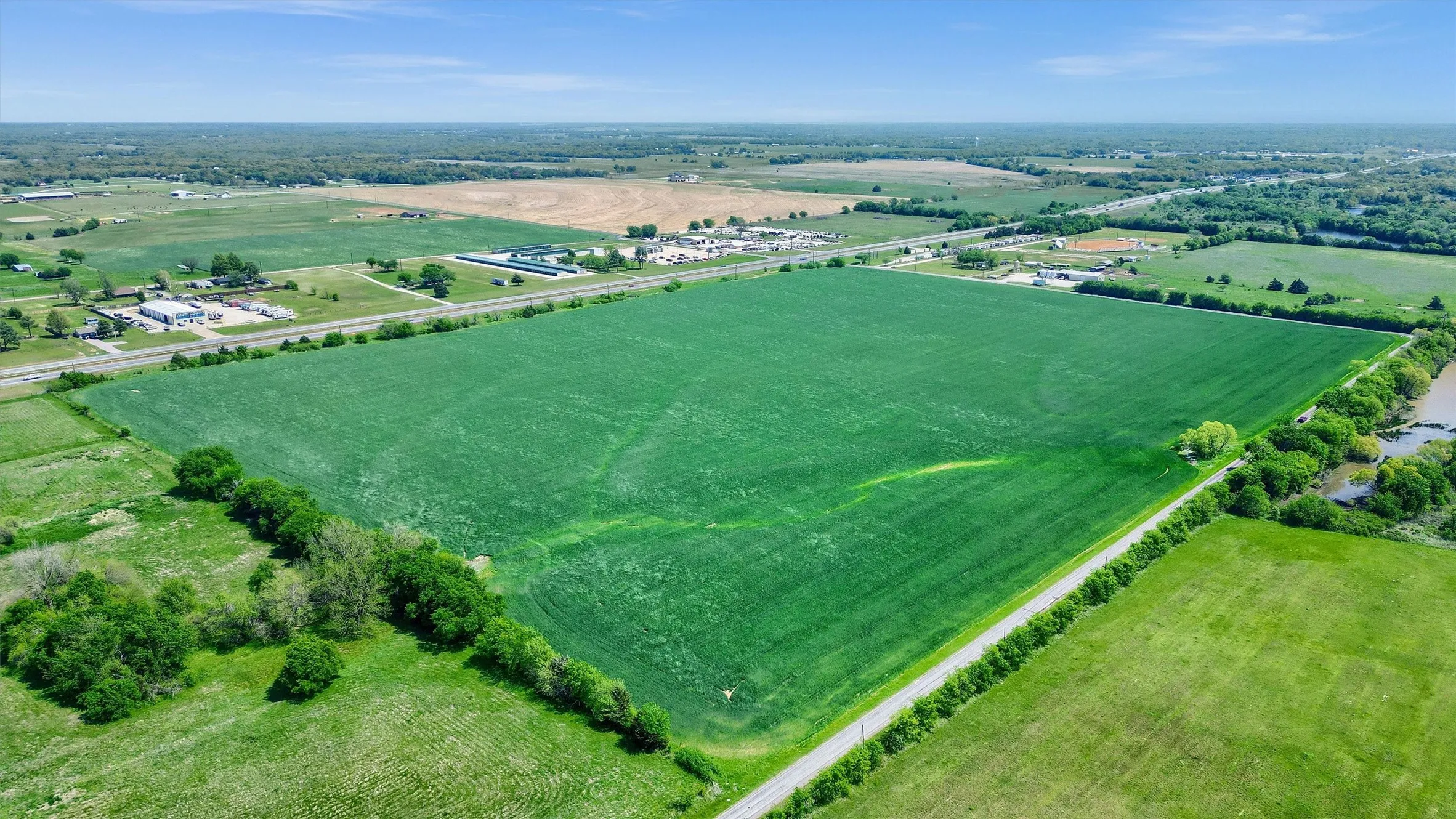 Birds eye view of property with a rural view