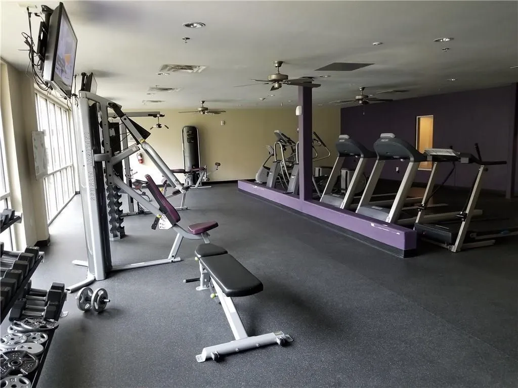 Workout area featuring a ceiling fan