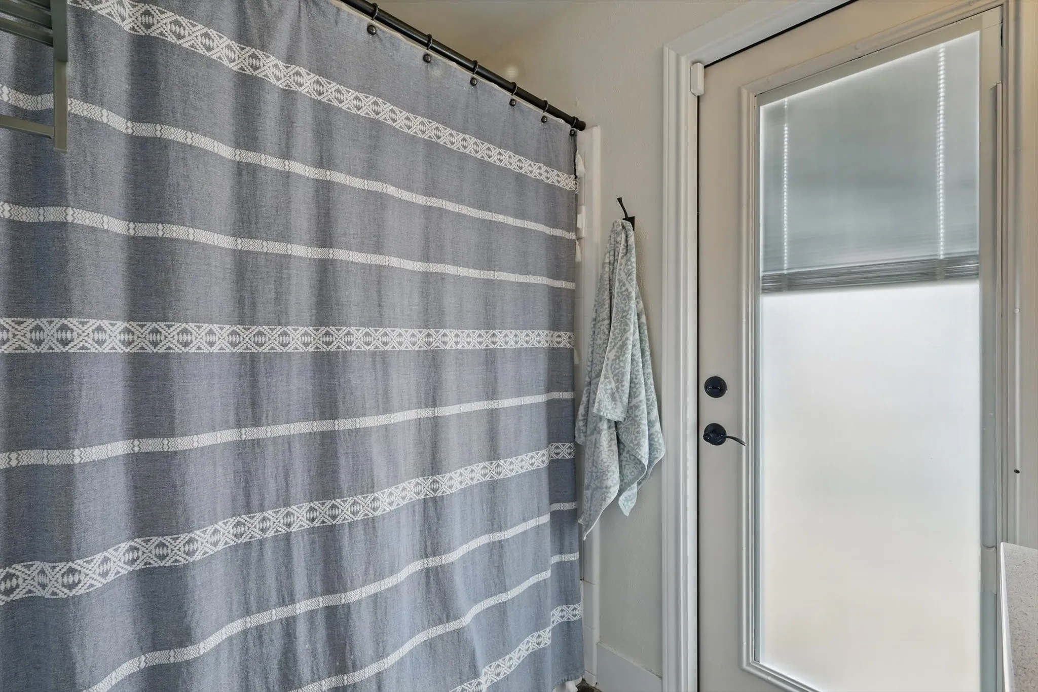 Bathroom featuring a shower with shower curtain