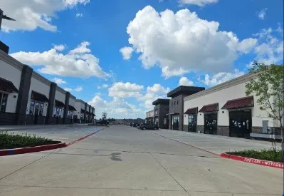 View of concrete street with curbs