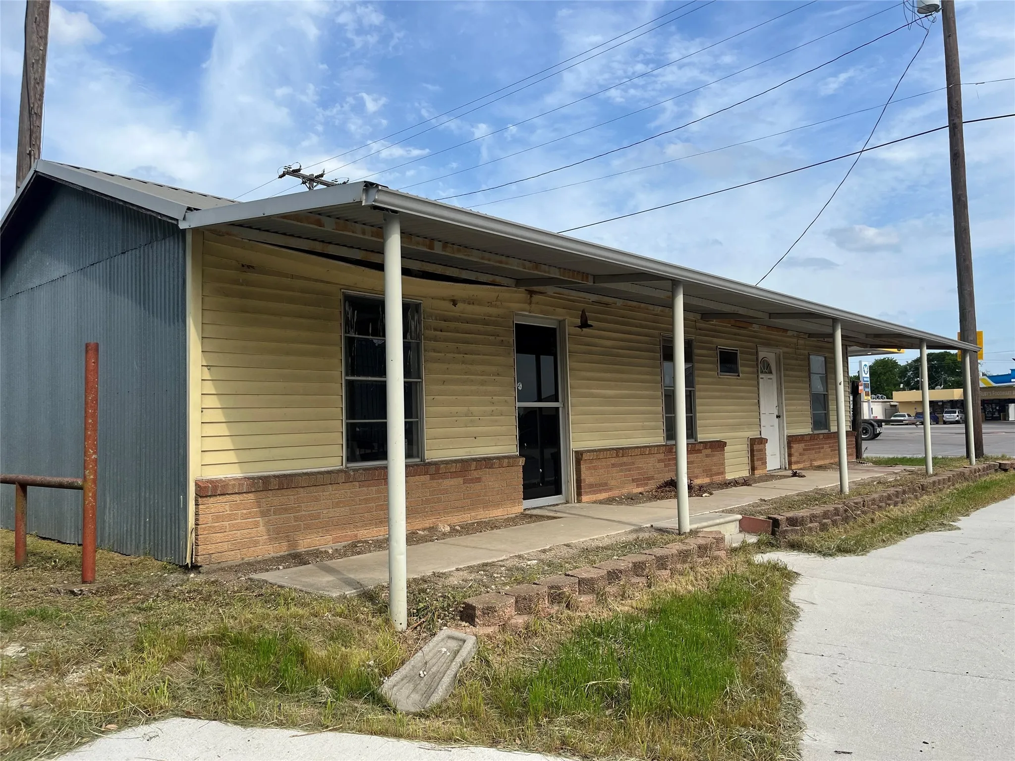View of front facade featuring brick siding