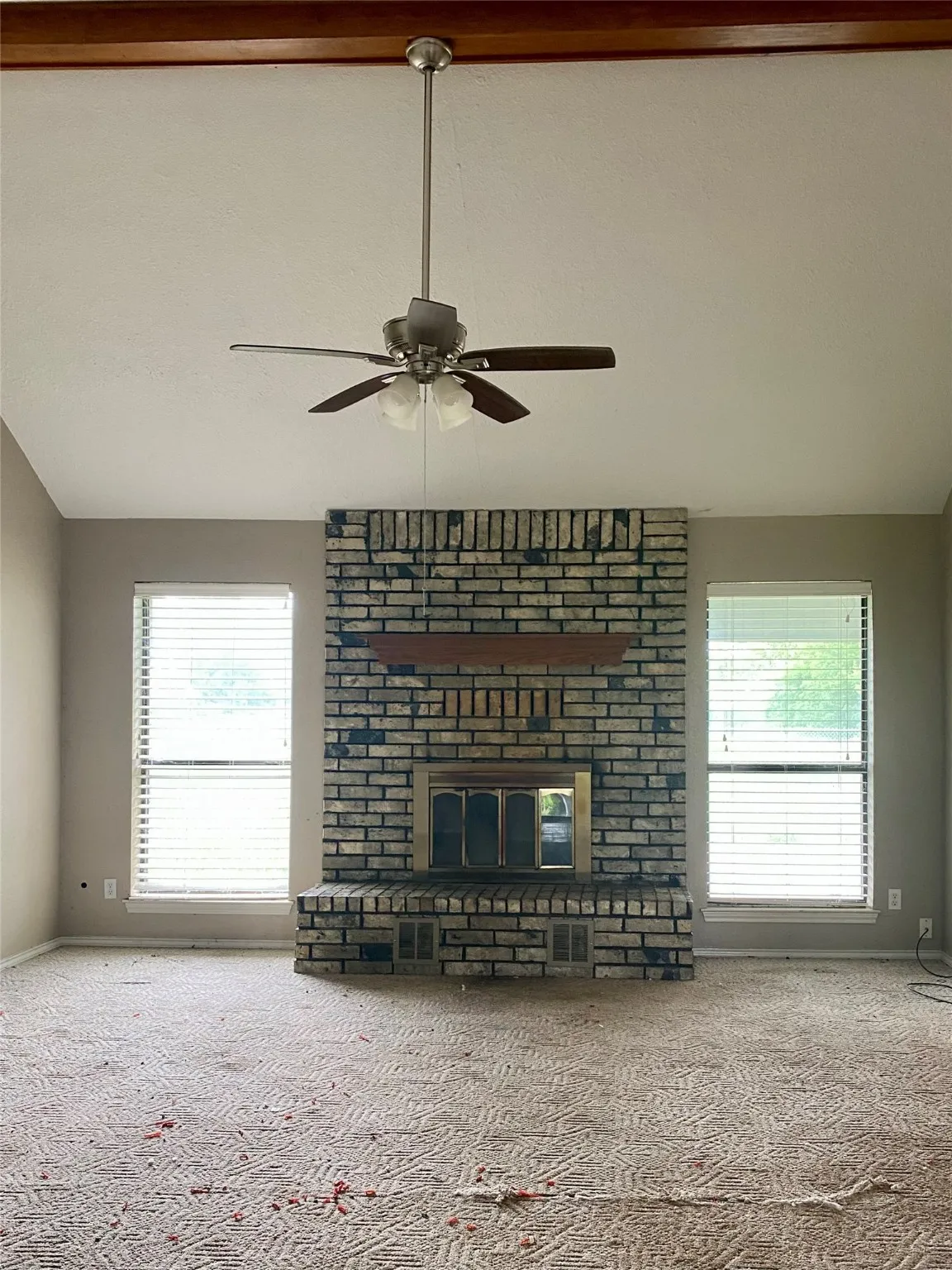 Living room with fireplace and vaulted ceiling