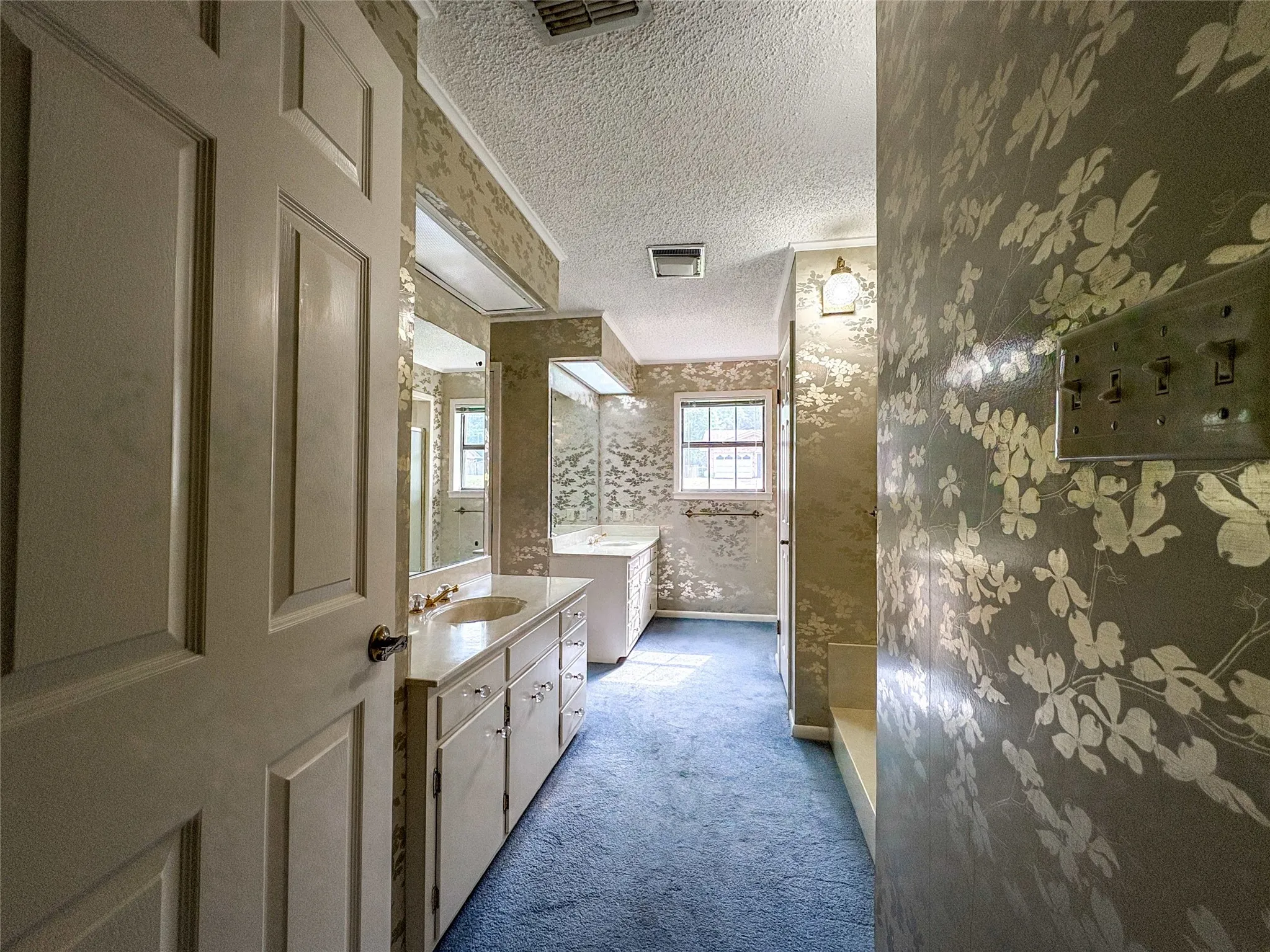 LARGE PRIMARY BATH WITH SEPARATE WITH SEPARATE SINKS, ABUNDANT STORAGE AND WALK IN CLOSET
