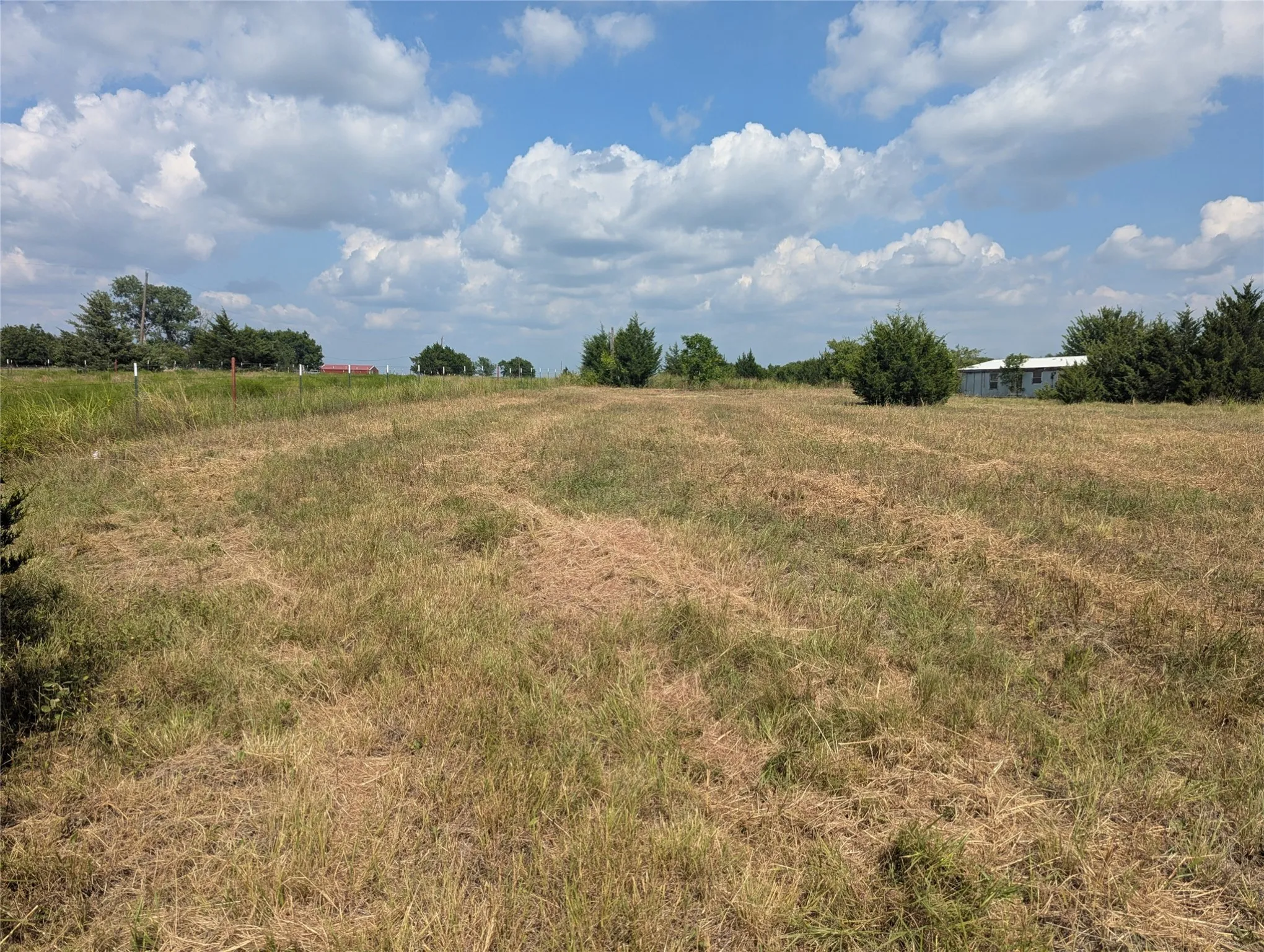 Freshly mowed. The home in photo is not included.
