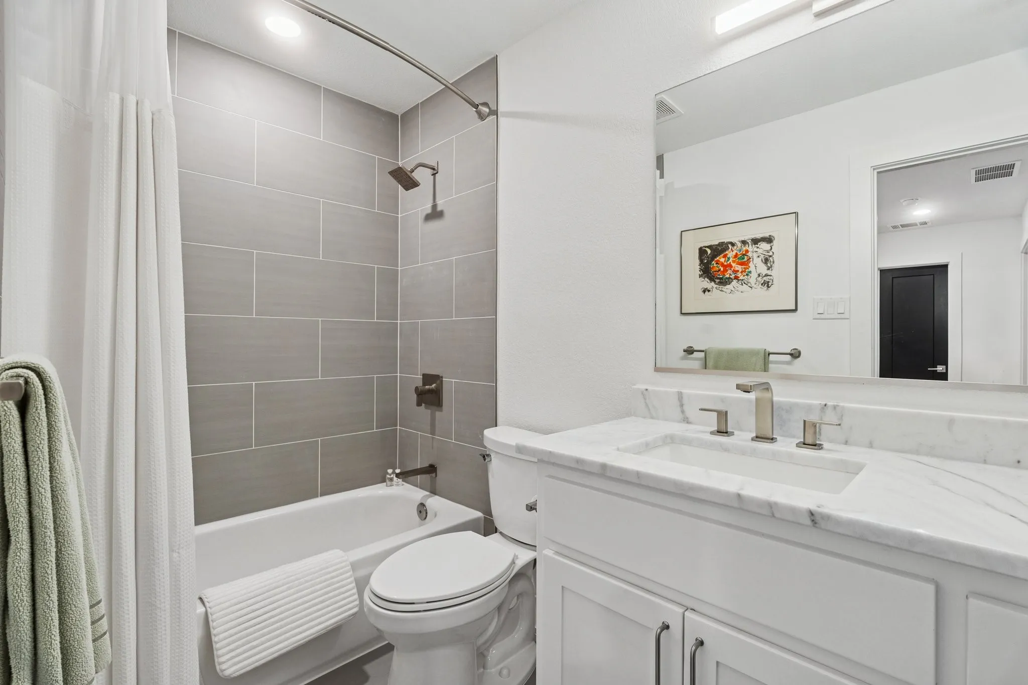 Full bathroom with vanity and shower / bath combination with curtain
