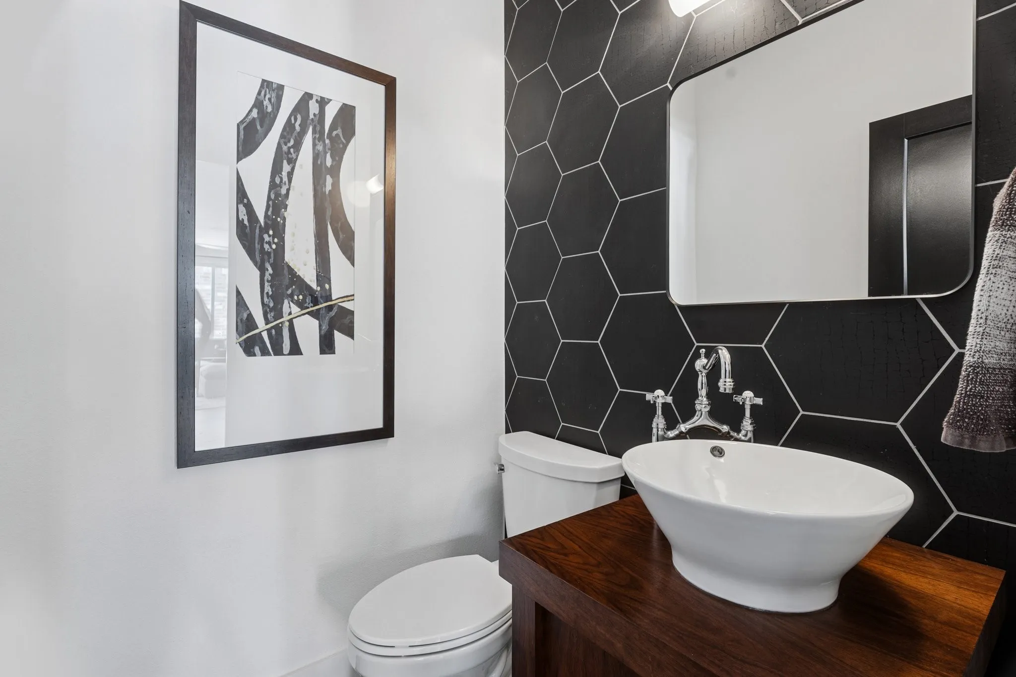 Bathroom with a sink and tile walls