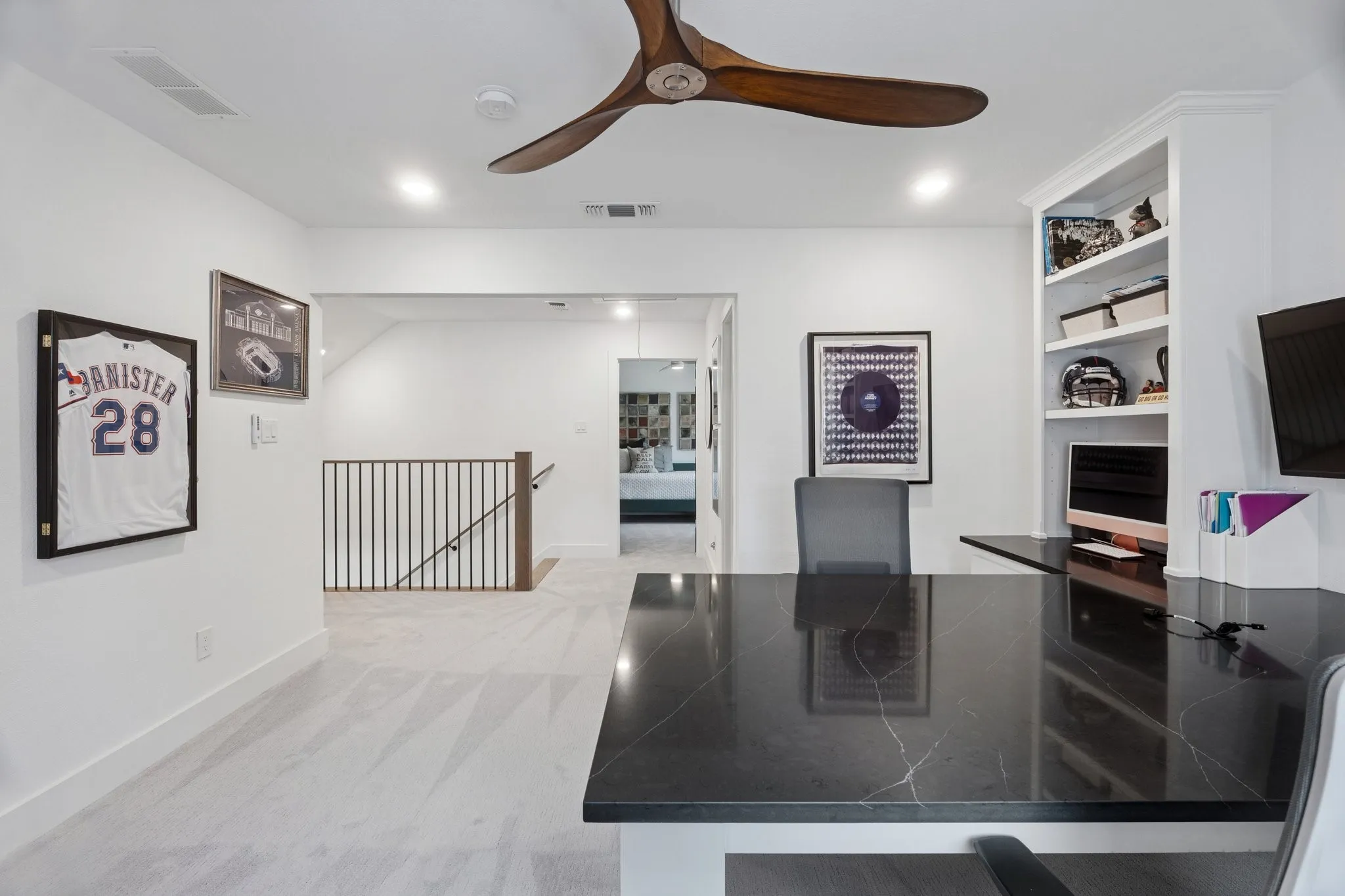 Office area with light colored carpet, ceiling fan, and recessed lighting
