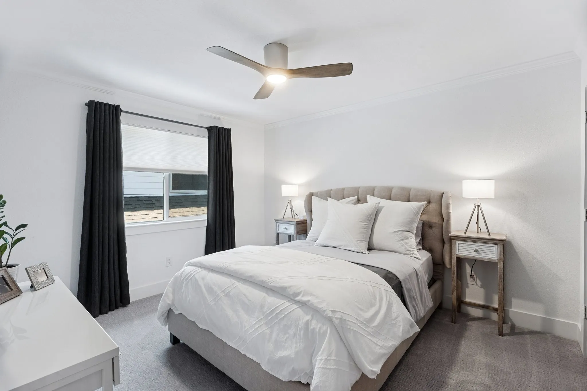 Carpeted bedroom featuring crown molding and a ceiling fan