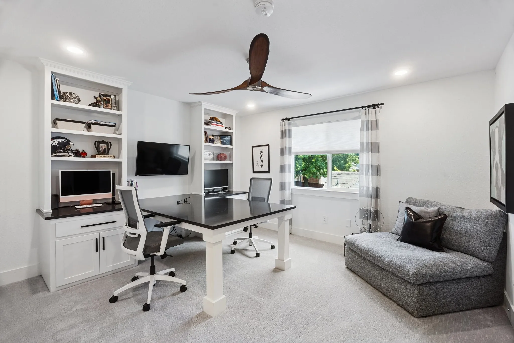 Office area with light carpet, a ceiling fan, recessed lighting, and built in shelves