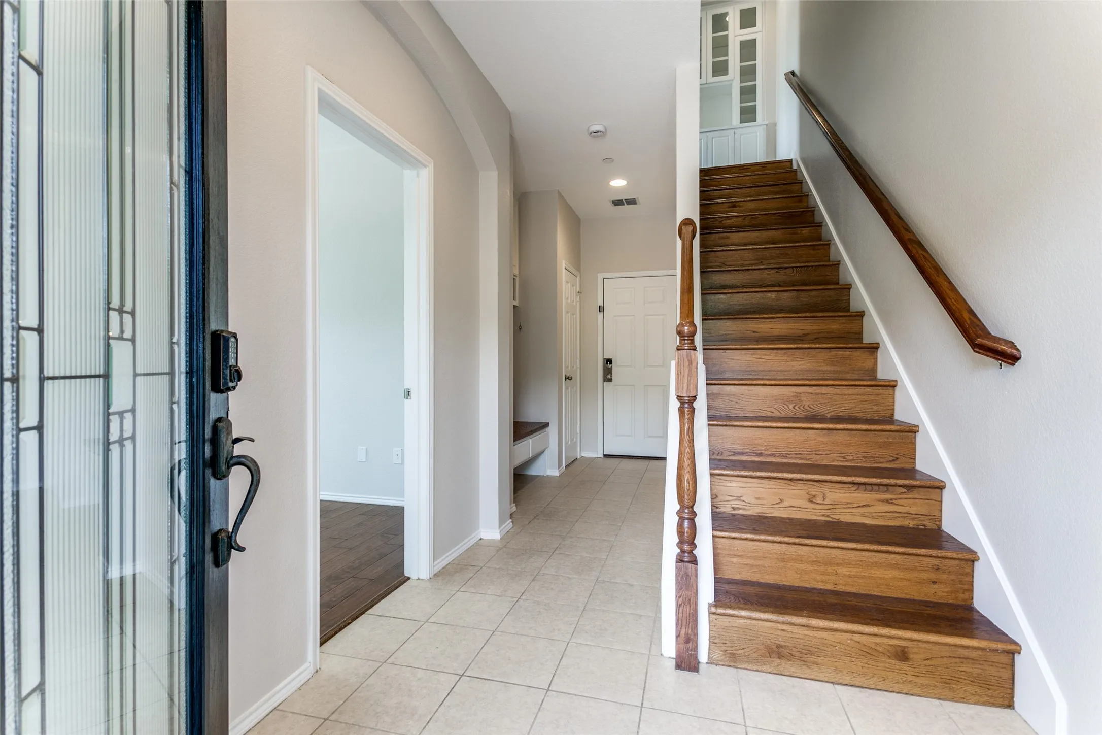 Entrance foyer, garage entrance with mudroom area
